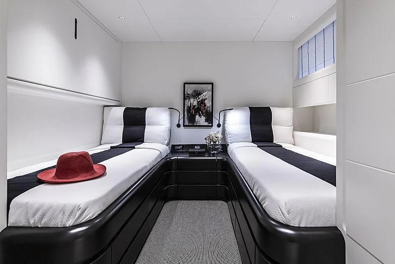 a room with two beds aboard PROJECT STEEL Yacht for Sale