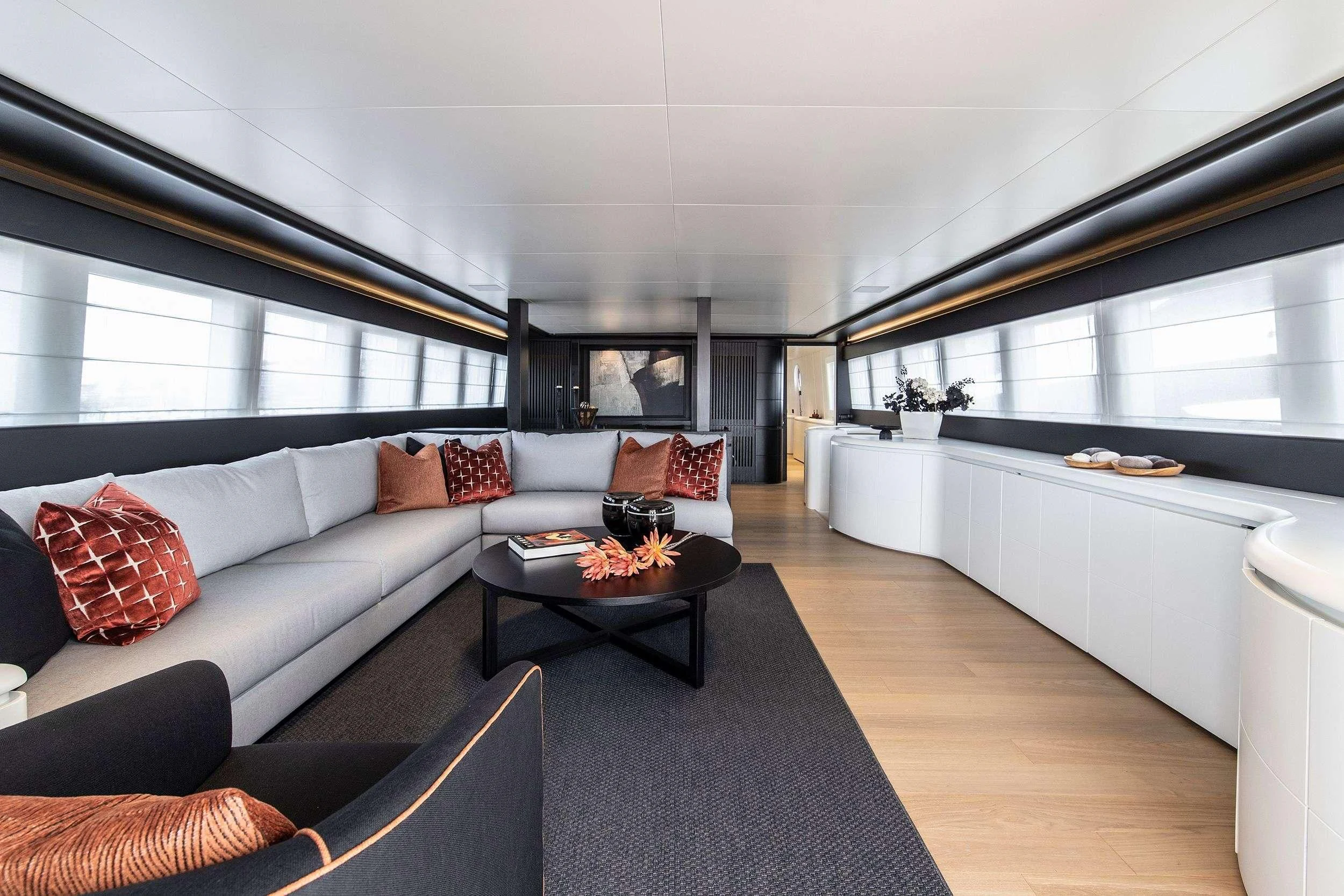 a living room with a large window aboard PROJECT STEEL Yacht for Sale