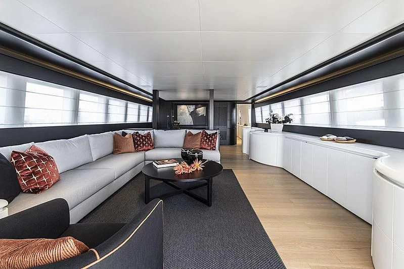 a living room with a large window aboard PROJECT STEEL Yacht for Sale
