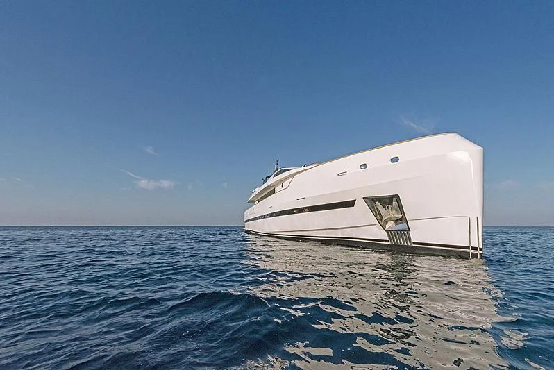 a white yacht on the water aboard PROJECT STEEL Yacht for Sale