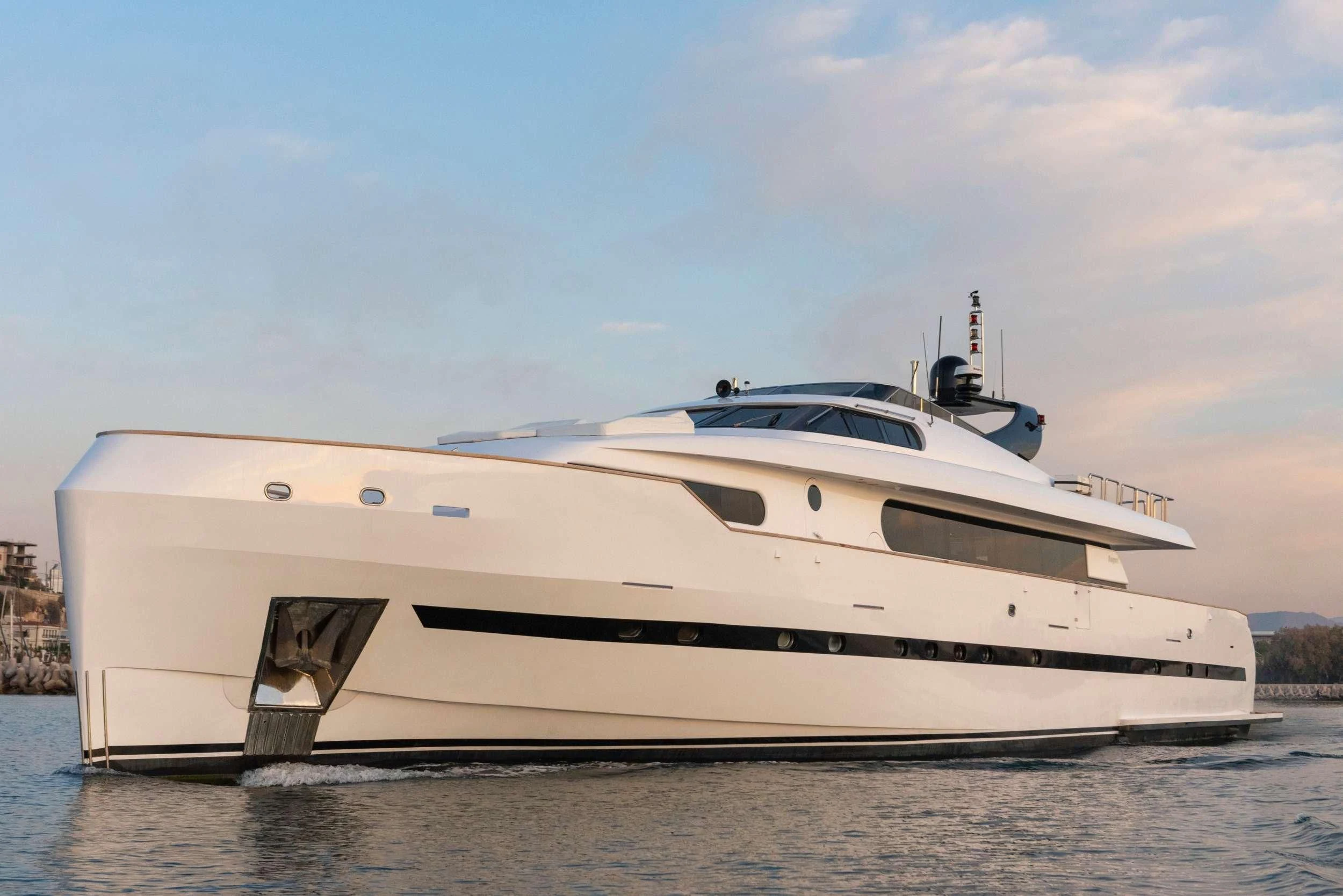 a white yacht on the water aboard PROJECT STEEL Yacht for Sale