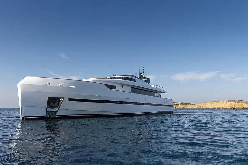 a white yacht on the water aboard PROJECT STEEL Yacht for Sale