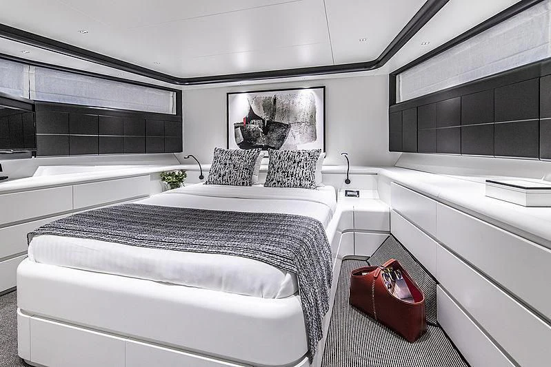 a room with a couple of beds aboard PROJECT STEEL Yacht for Sale