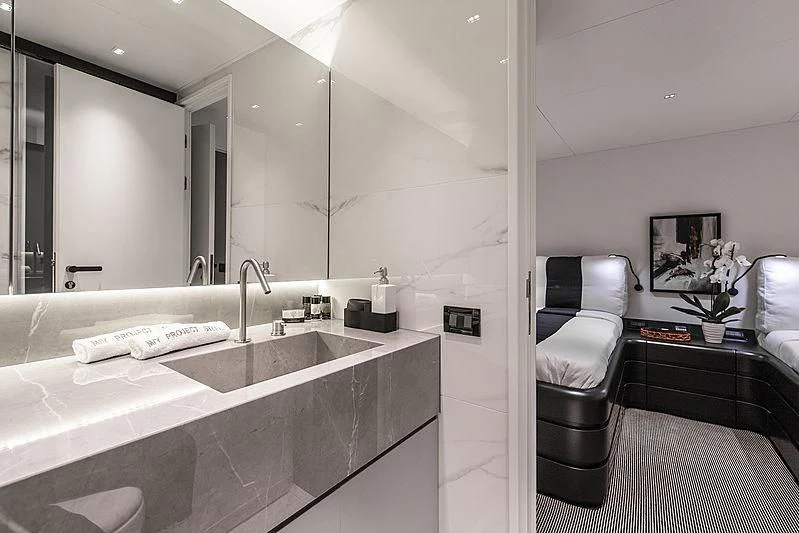 a bathroom with a large mirror aboard PROJECT STEEL Yacht for Sale