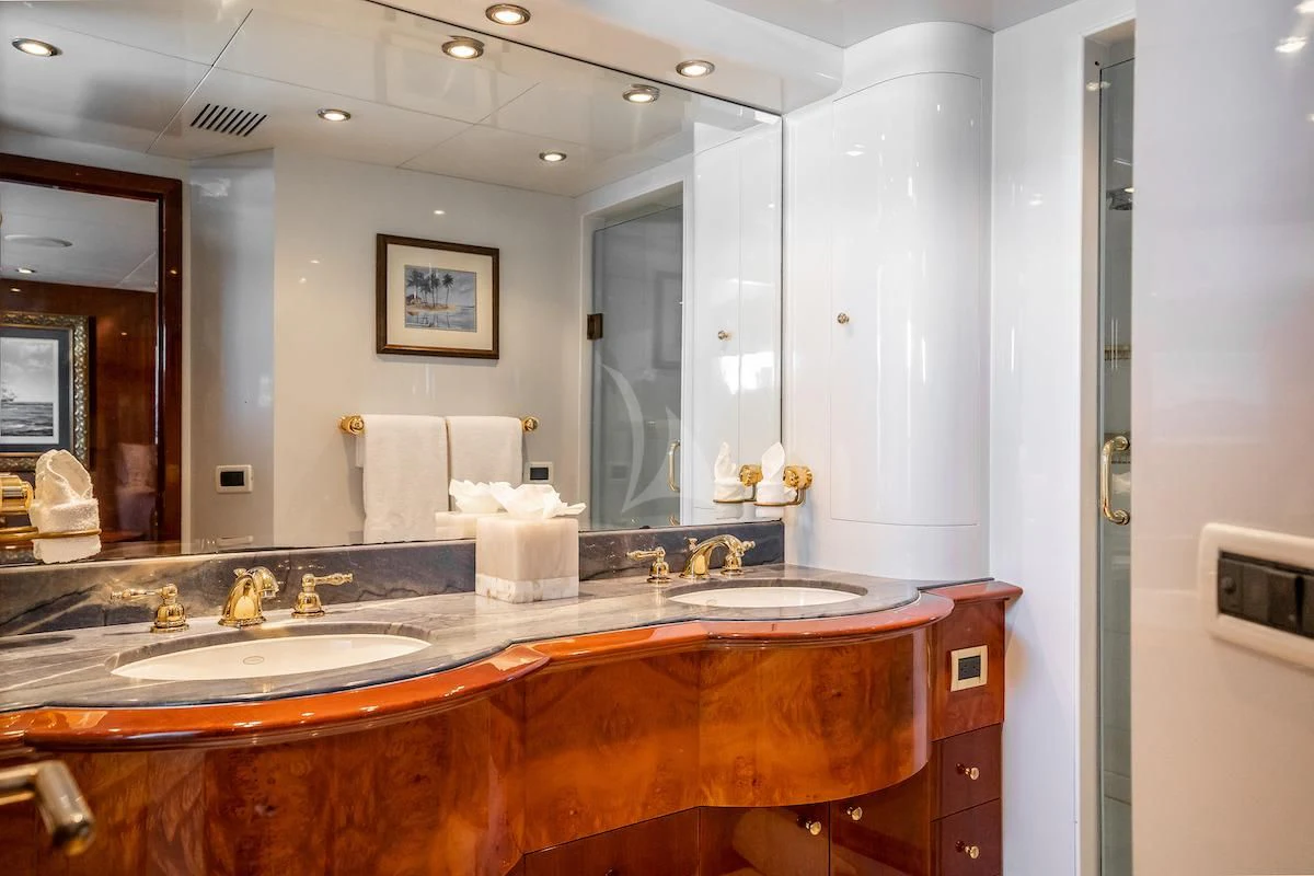 a bathroom with a countertop sink and mirror aboard OUTTA TOUCH Yacht for Sale