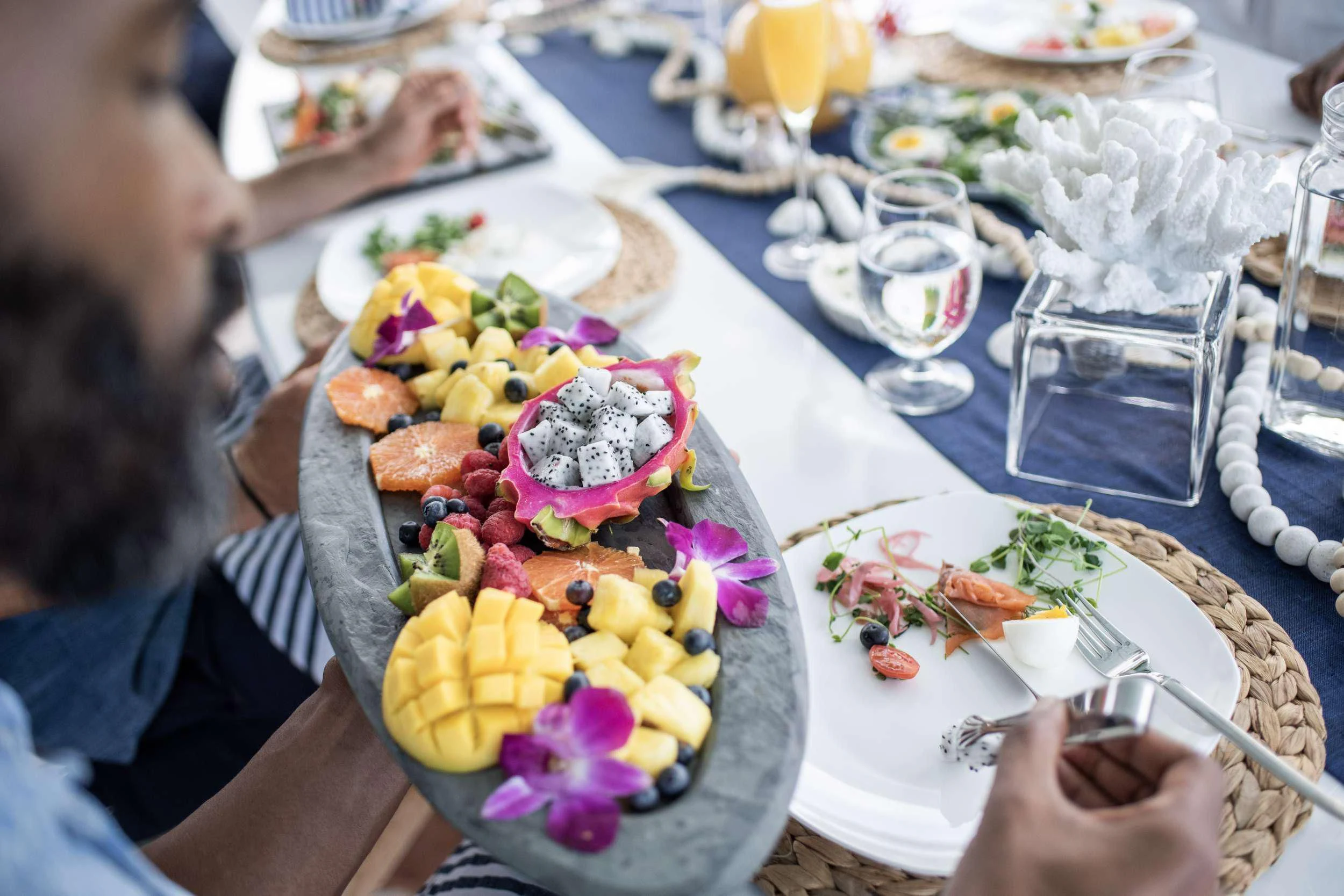 a person eating a meal at a table aboard OUTTA TOUCH Yacht for Sale