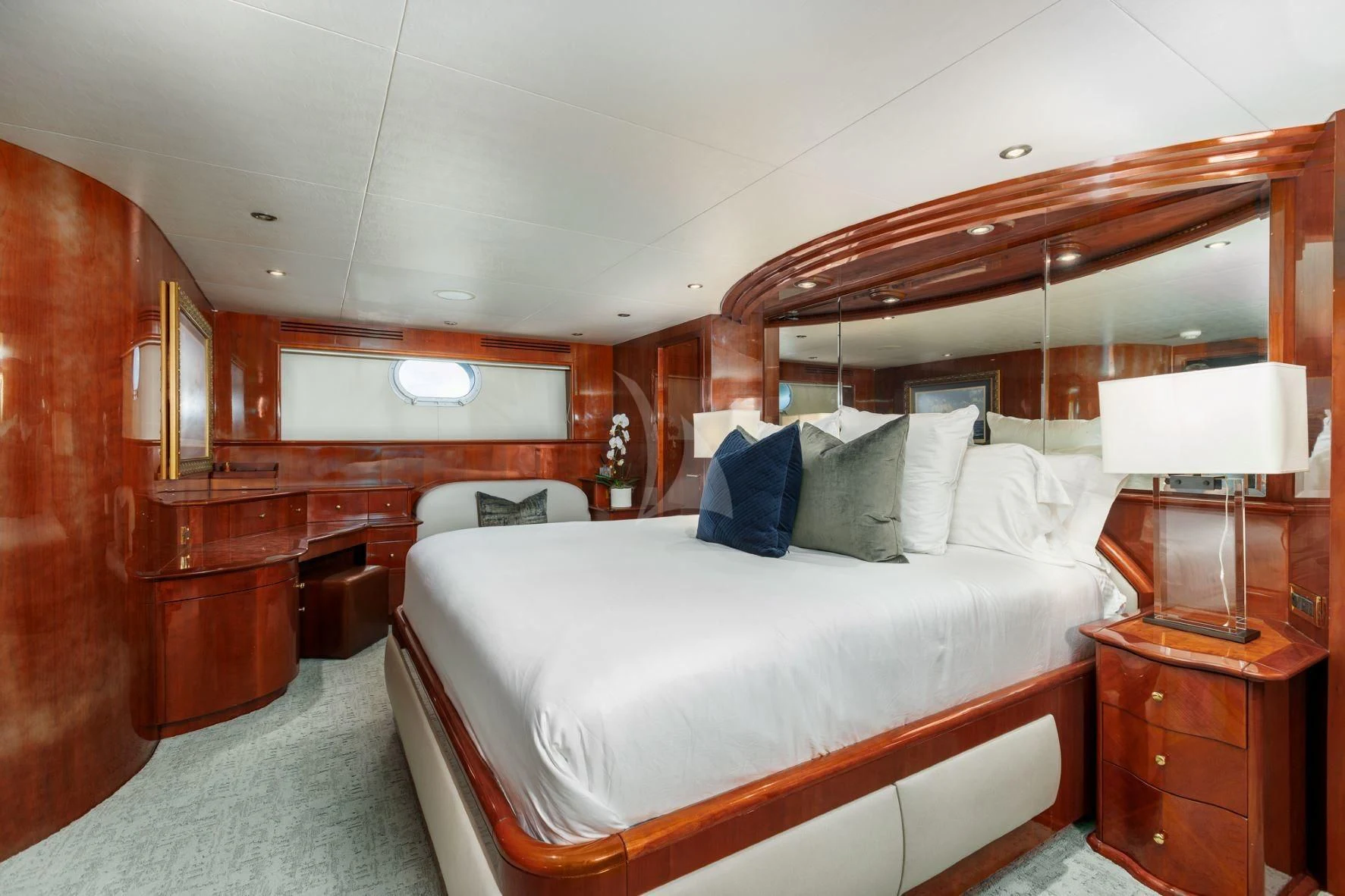 a bedroom with a bed and a desk aboard OUTTA TOUCH Yacht for Sale