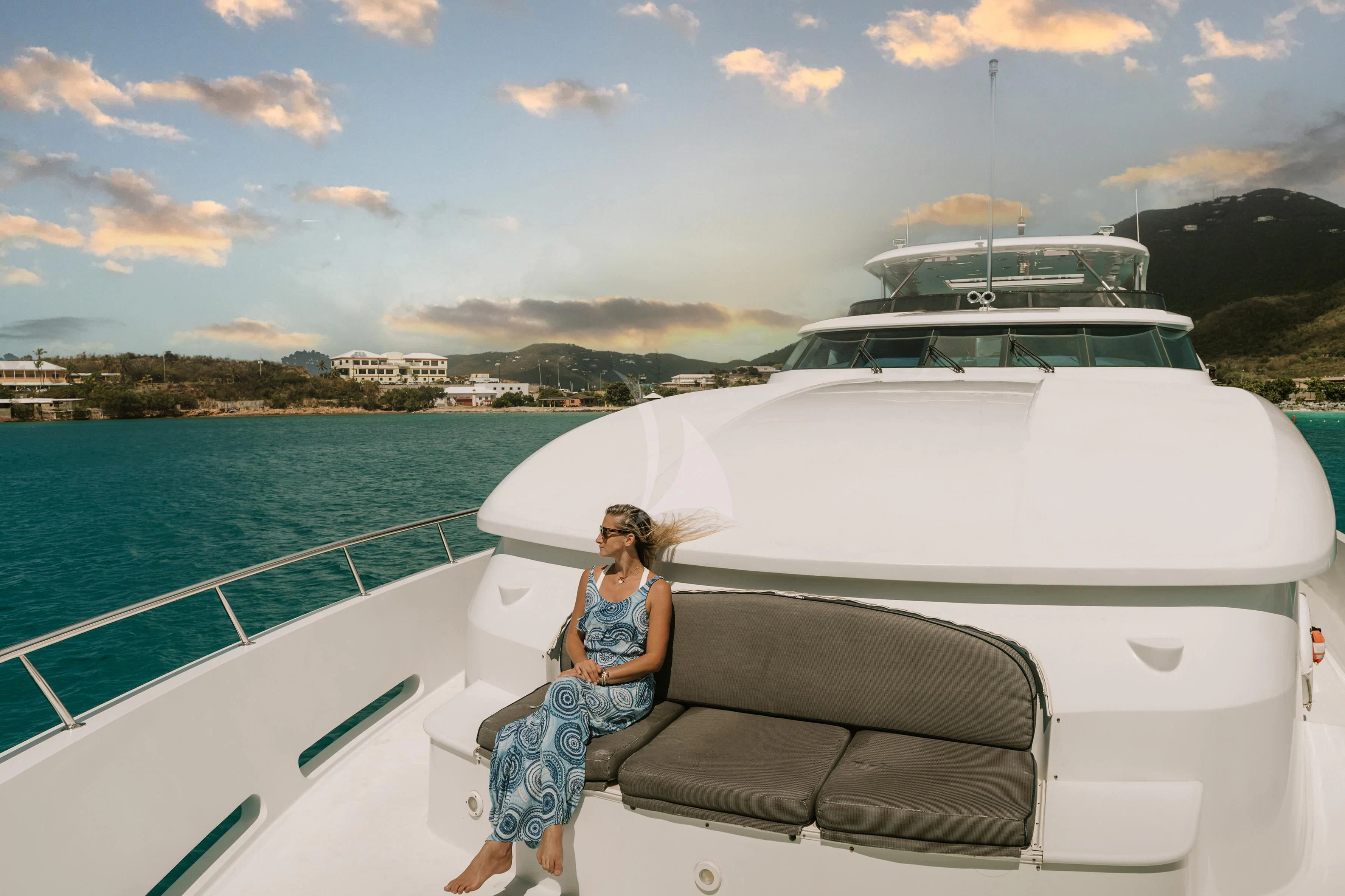 a person sitting on a boat aboard OUTTA TOUCH Yacht for Sale