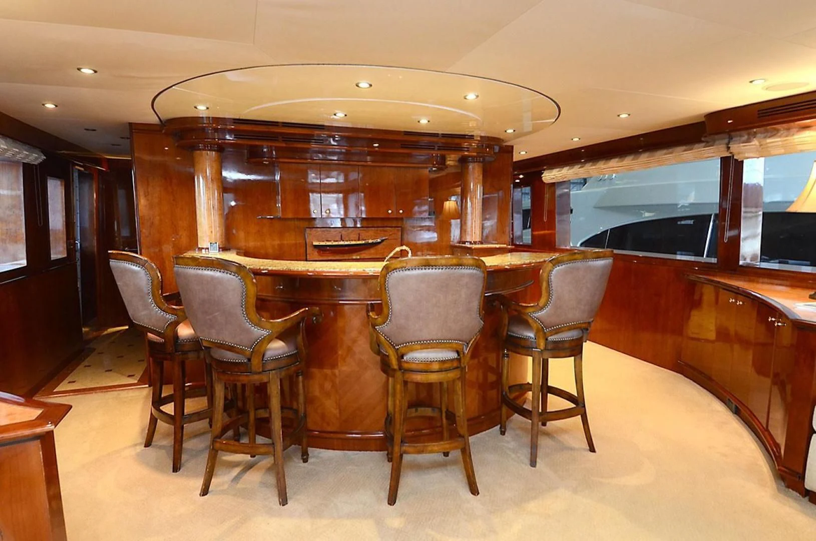 a room with chairs and a table aboard OUTTA TOUCH Yacht for Sale