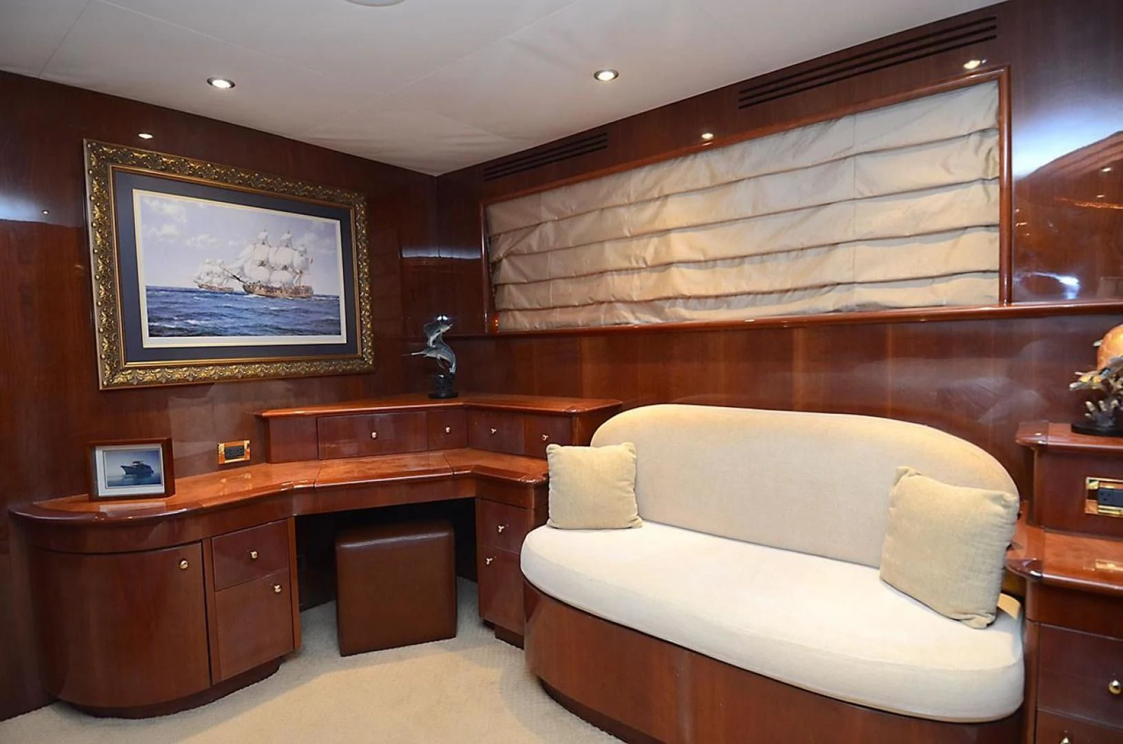 a room with a bed and a painting on the wall aboard OUTTA TOUCH Yacht for Sale