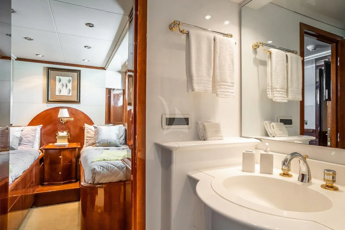 a bathroom with a sink and a mirror aboard OUTTA TOUCH Yacht for Sale