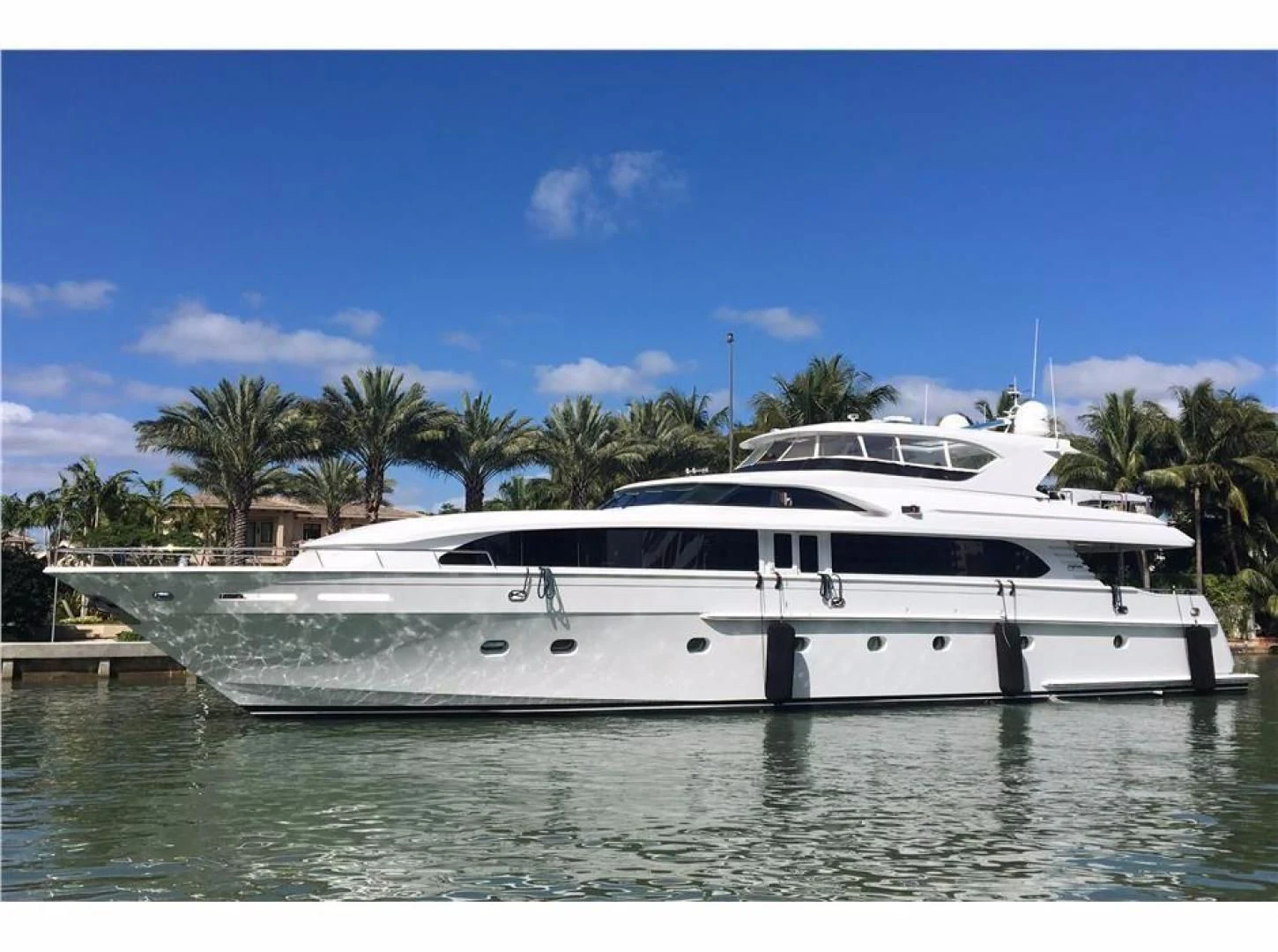 a white yacht in the water aboard OUTTA TOUCH Yacht for Sale