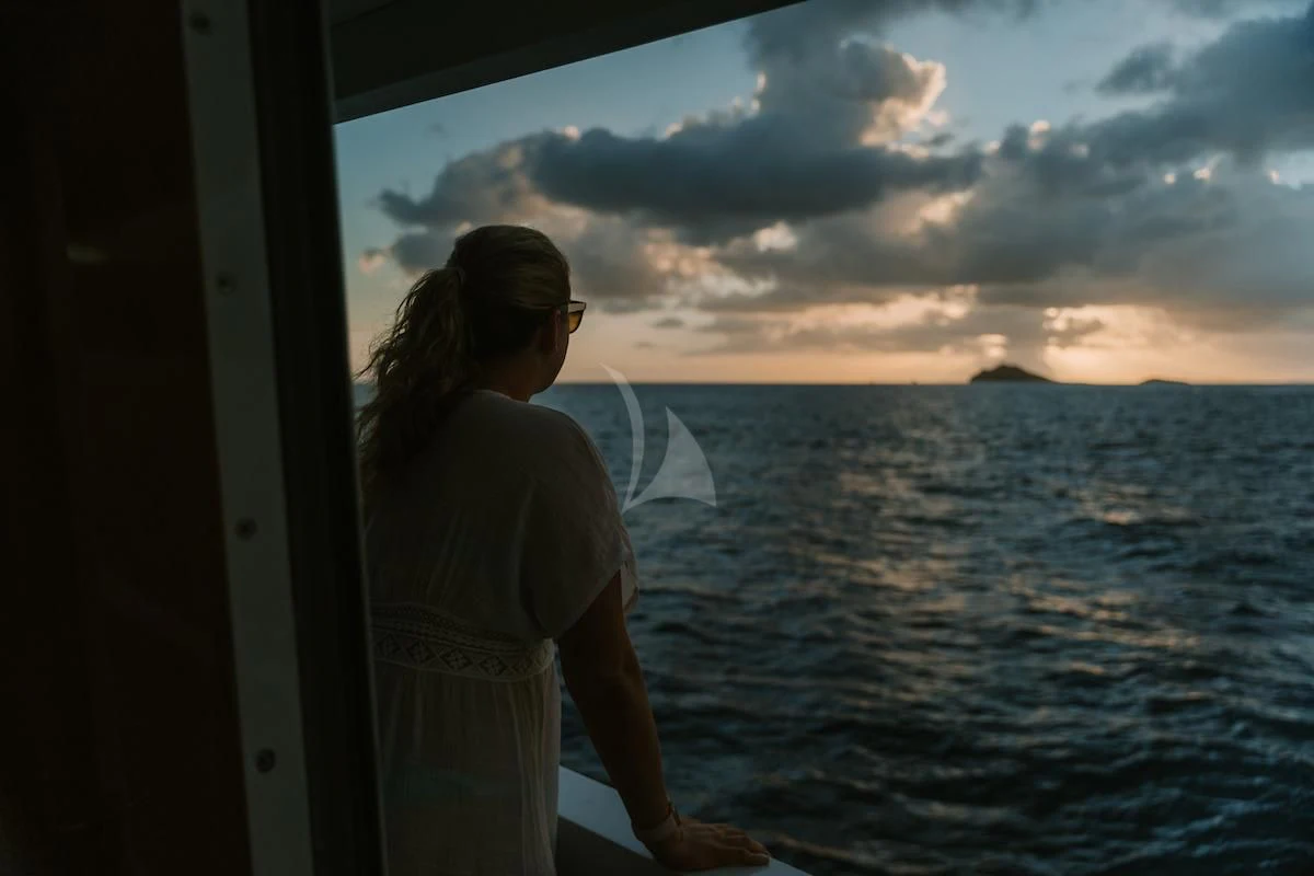 a man standing on a boat aboard OUTTA TOUCH Yacht for Sale