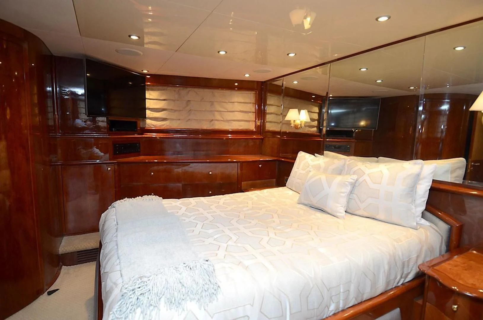 a bed with white sheets aboard OUTTA TOUCH Yacht for Sale