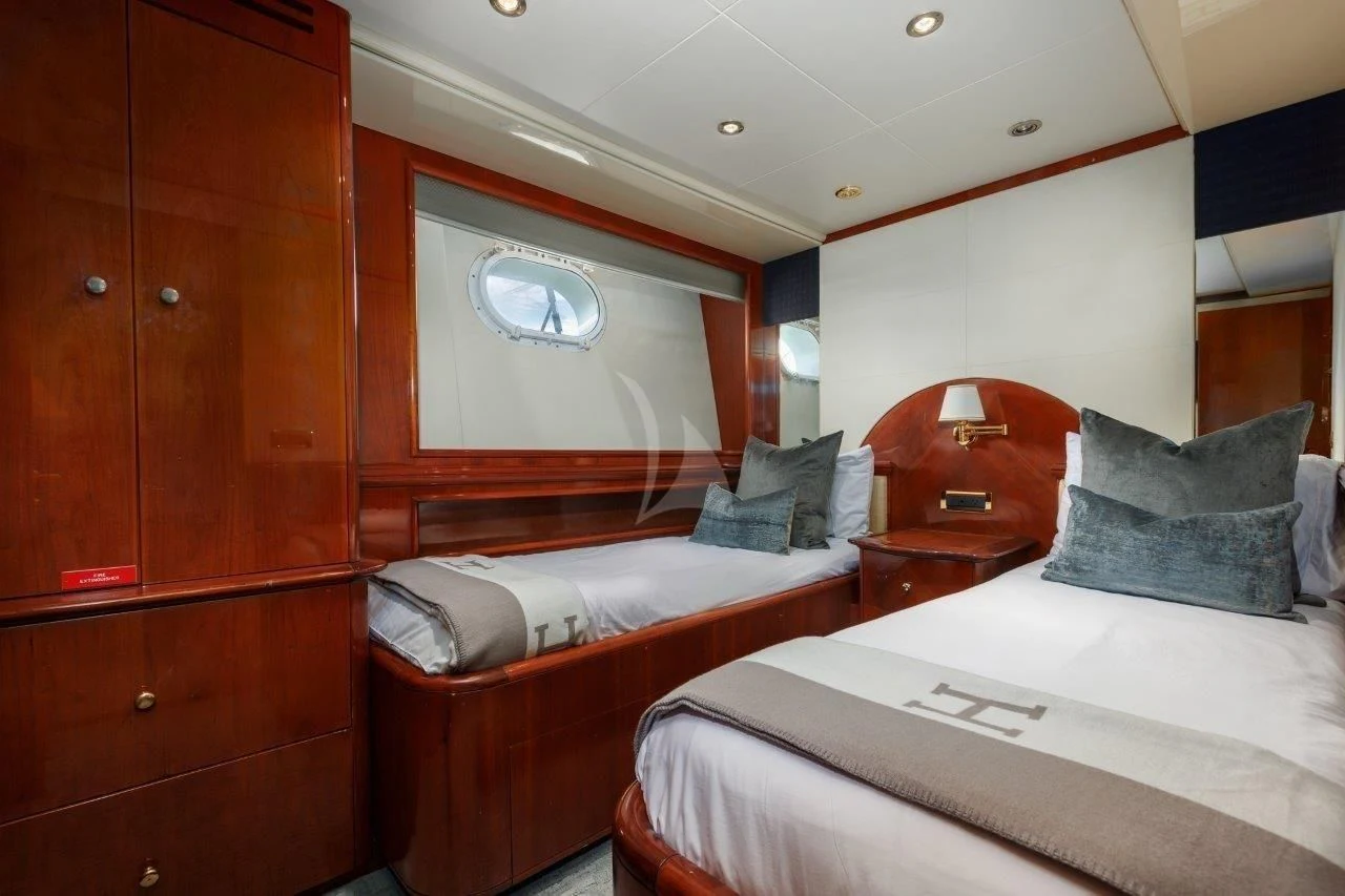 a couple of beds in a room aboard OUTTA TOUCH Yacht for Sale