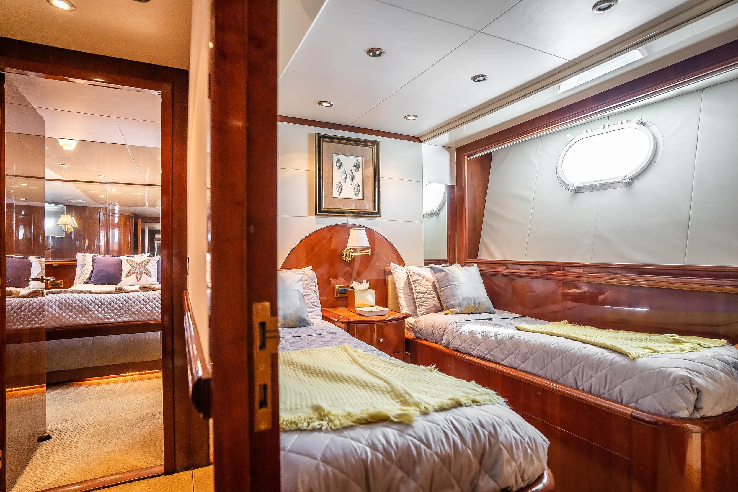 a room with beds and a wood door aboard OUTTA TOUCH Yacht for Sale