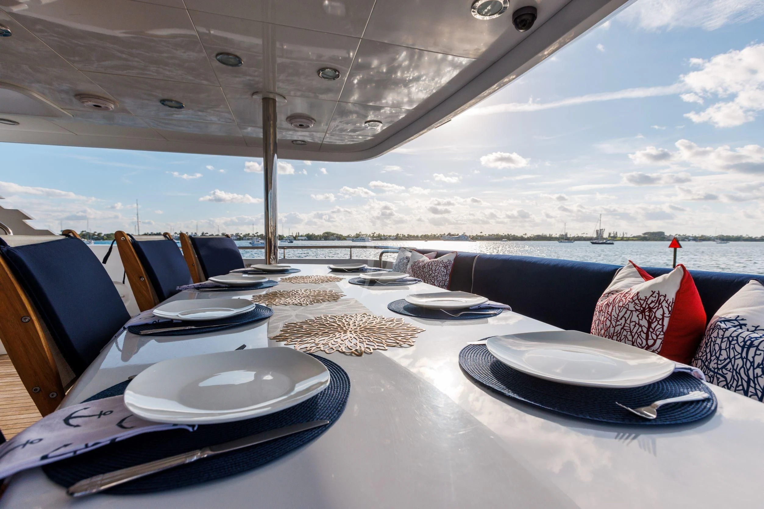 a table with plates and plates on it aboard OUTTA TOUCH Yacht for Sale