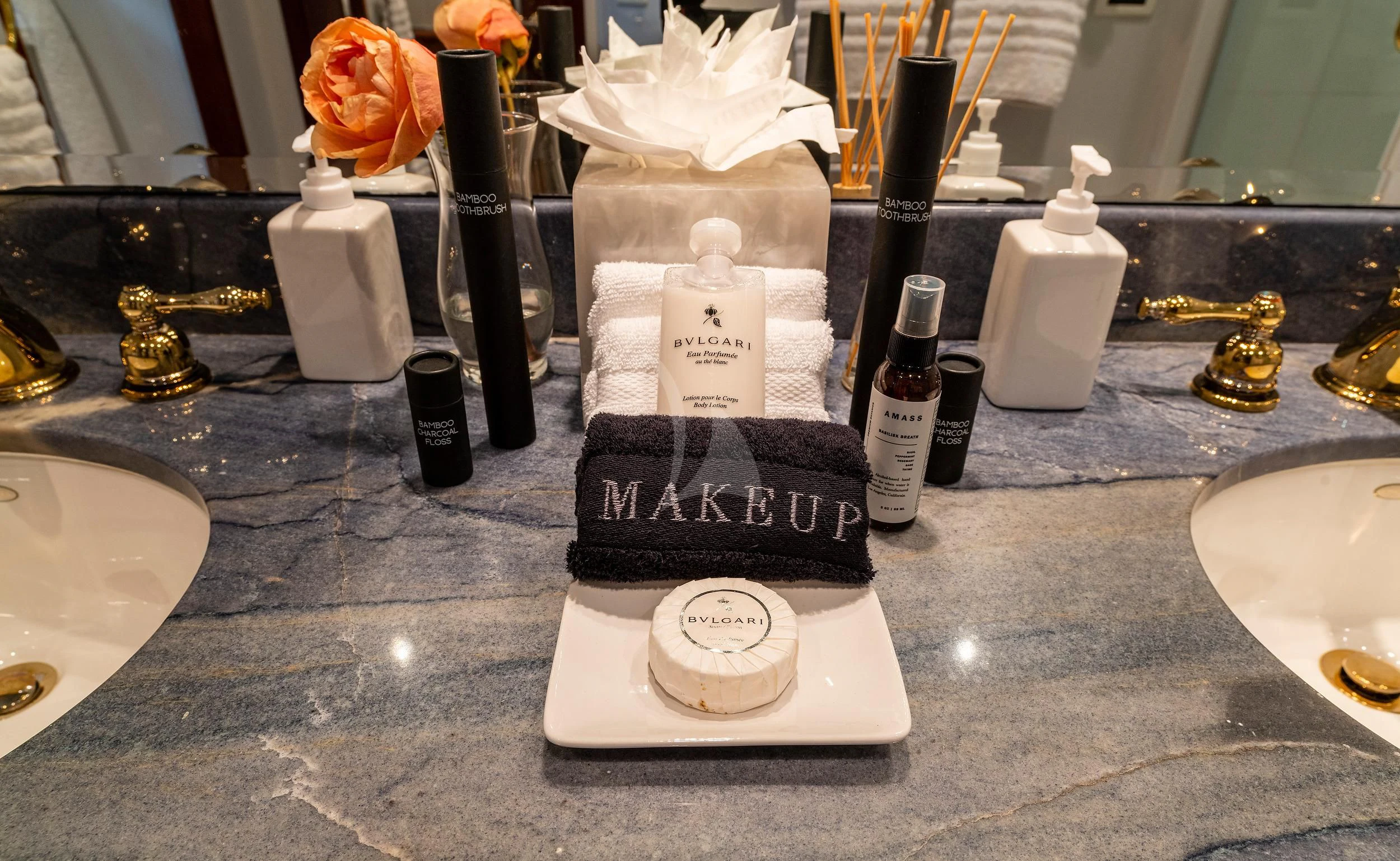 a group of wine bottles and wine glasses on a counter aboard OUTTA TOUCH Yacht for Sale