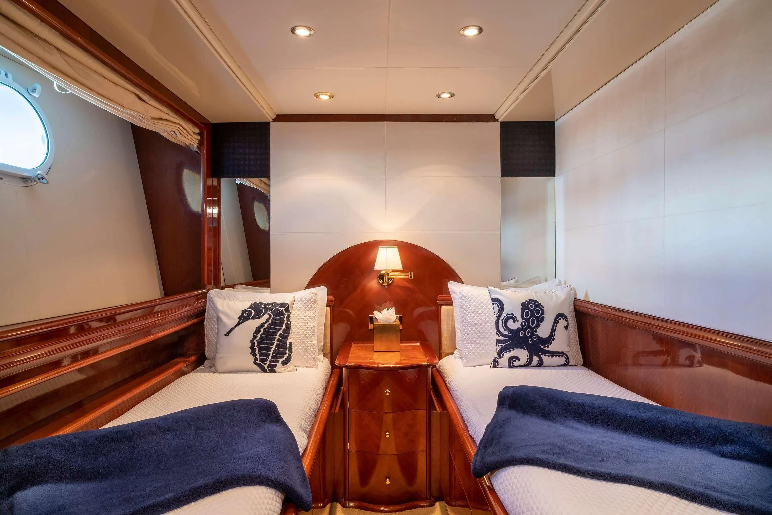 a room with a bed and a table aboard OUTTA TOUCH Yacht for Sale