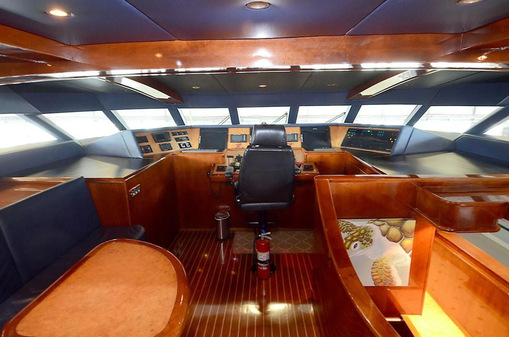 a room with seats and a table aboard OUTTA TOUCH Yacht for Sale
