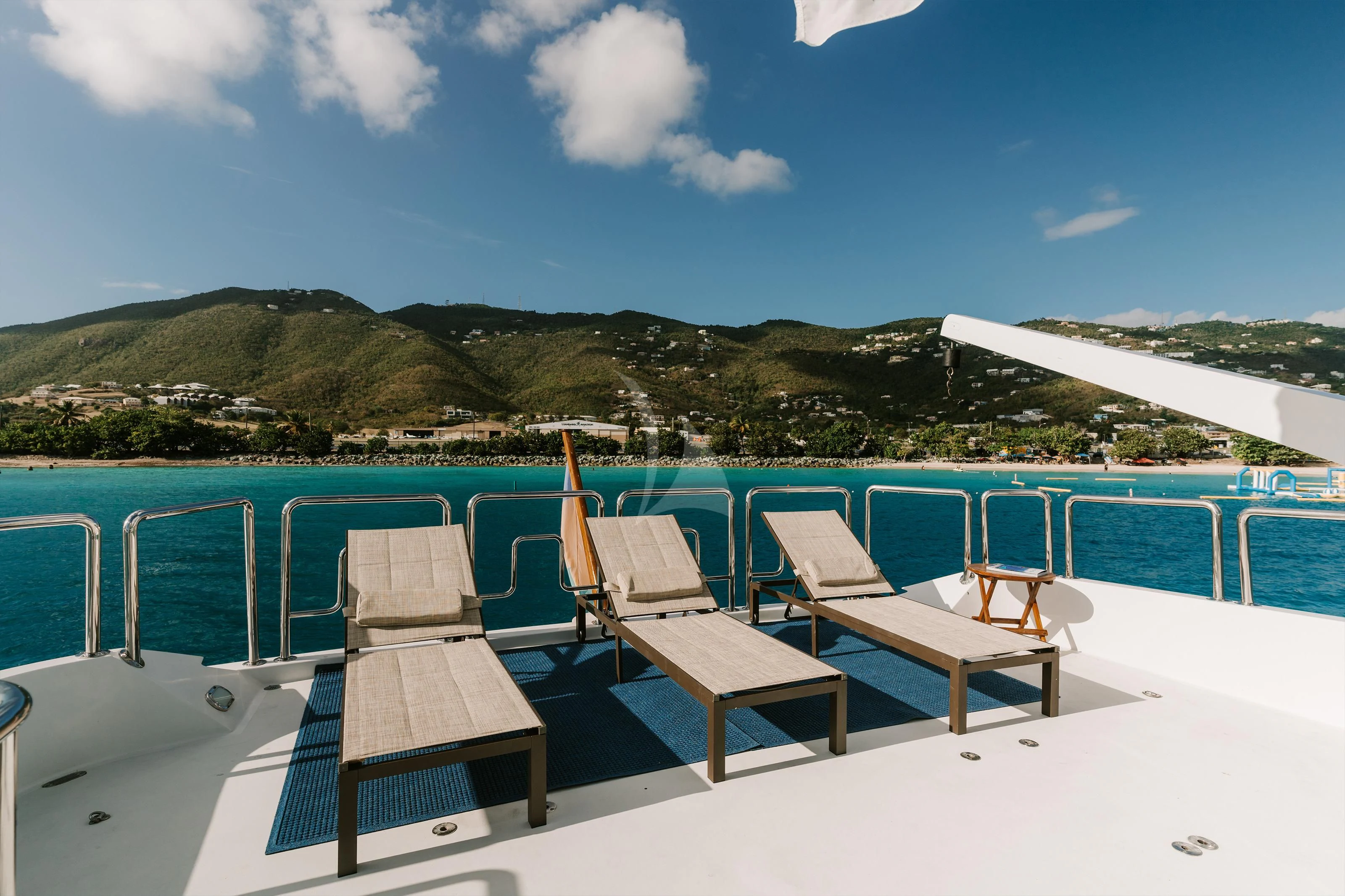 a pool with chairs and tables aboard OUTTA TOUCH Yacht for Sale