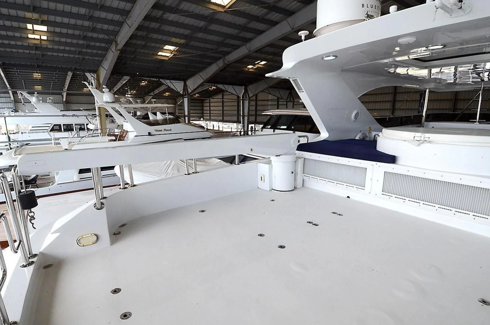 a large white airplane in a hangar aboard OUTTA TOUCH Yacht for Sale