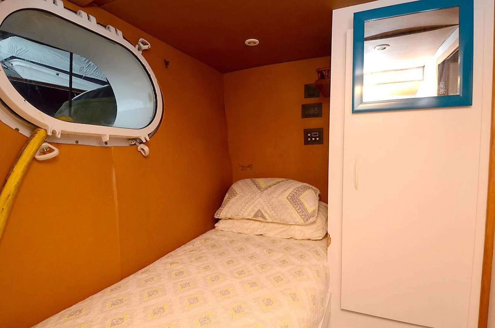 a bed with a white bed and a white bed aboard OUTTA TOUCH Yacht for Sale