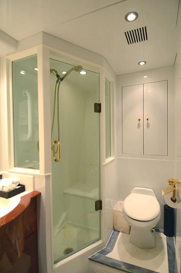 a bathroom with a green door aboard OUTTA TOUCH Yacht for Sale