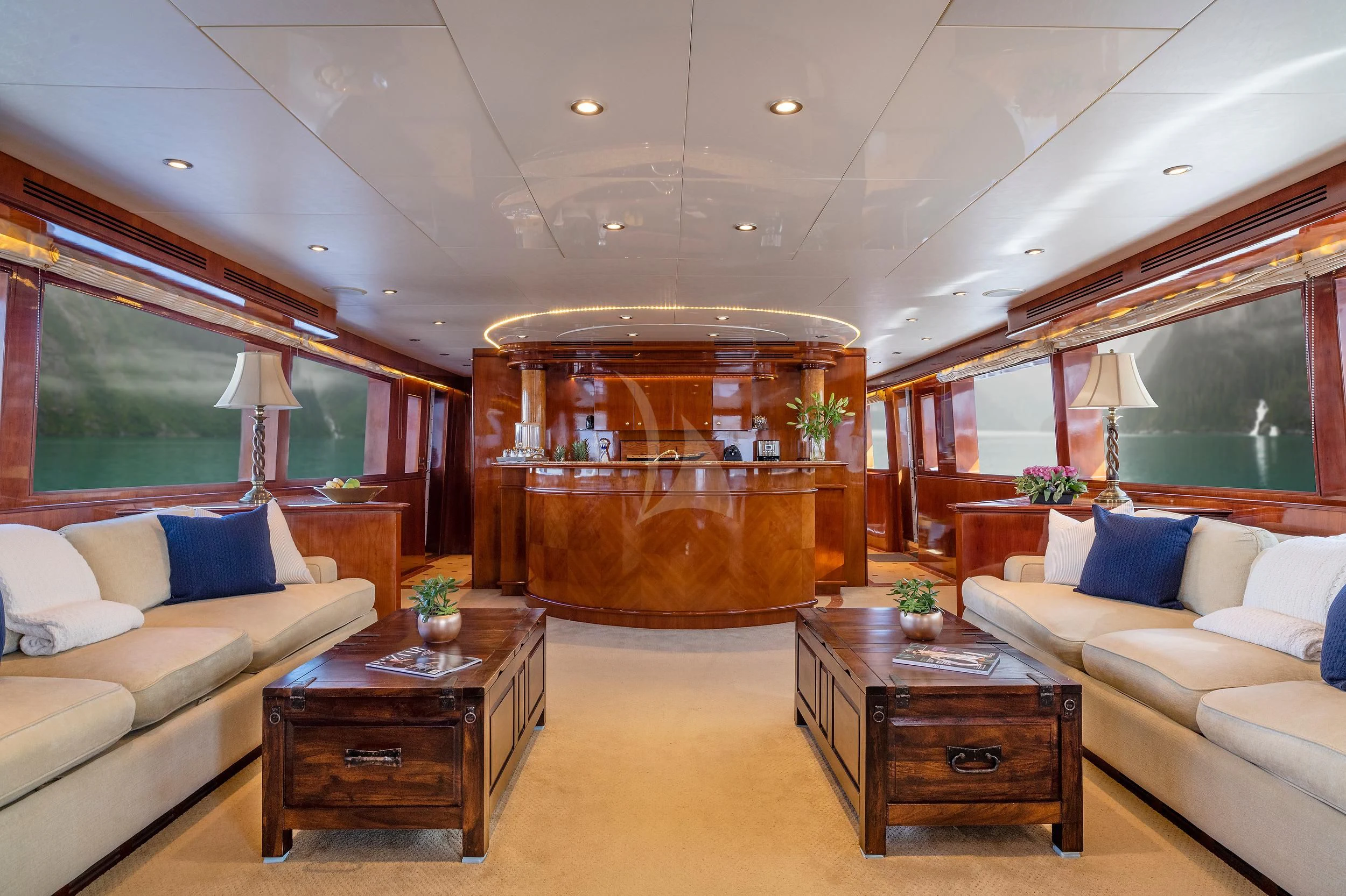 a living room with a large fireplace aboard OUTTA TOUCH Yacht for Sale