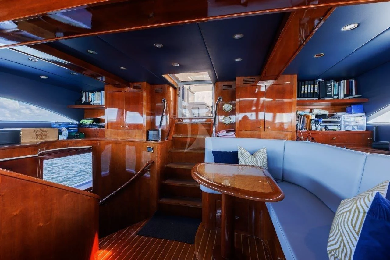 a room with a couch and a table aboard OUTTA TOUCH Yacht for Sale