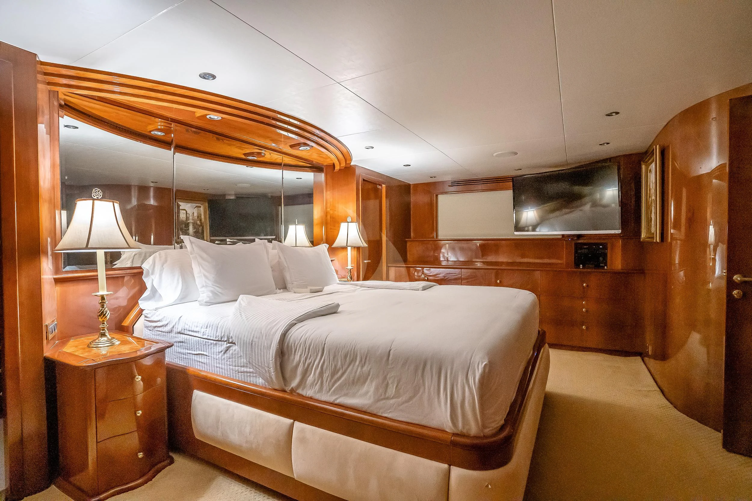 a room with a bed and a mirror aboard OUTTA TOUCH Yacht for Sale