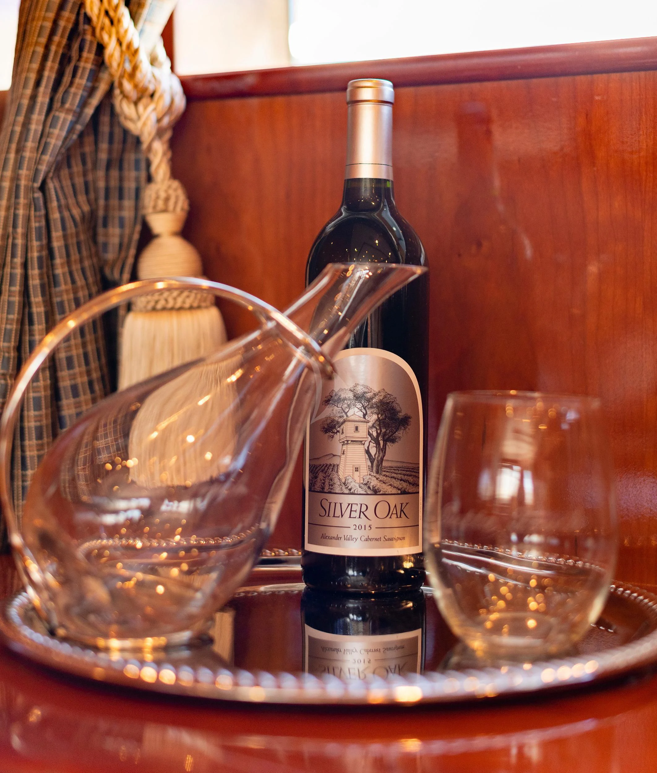 a bottle of wine and a glass aboard OUTTA TOUCH Yacht for Sale