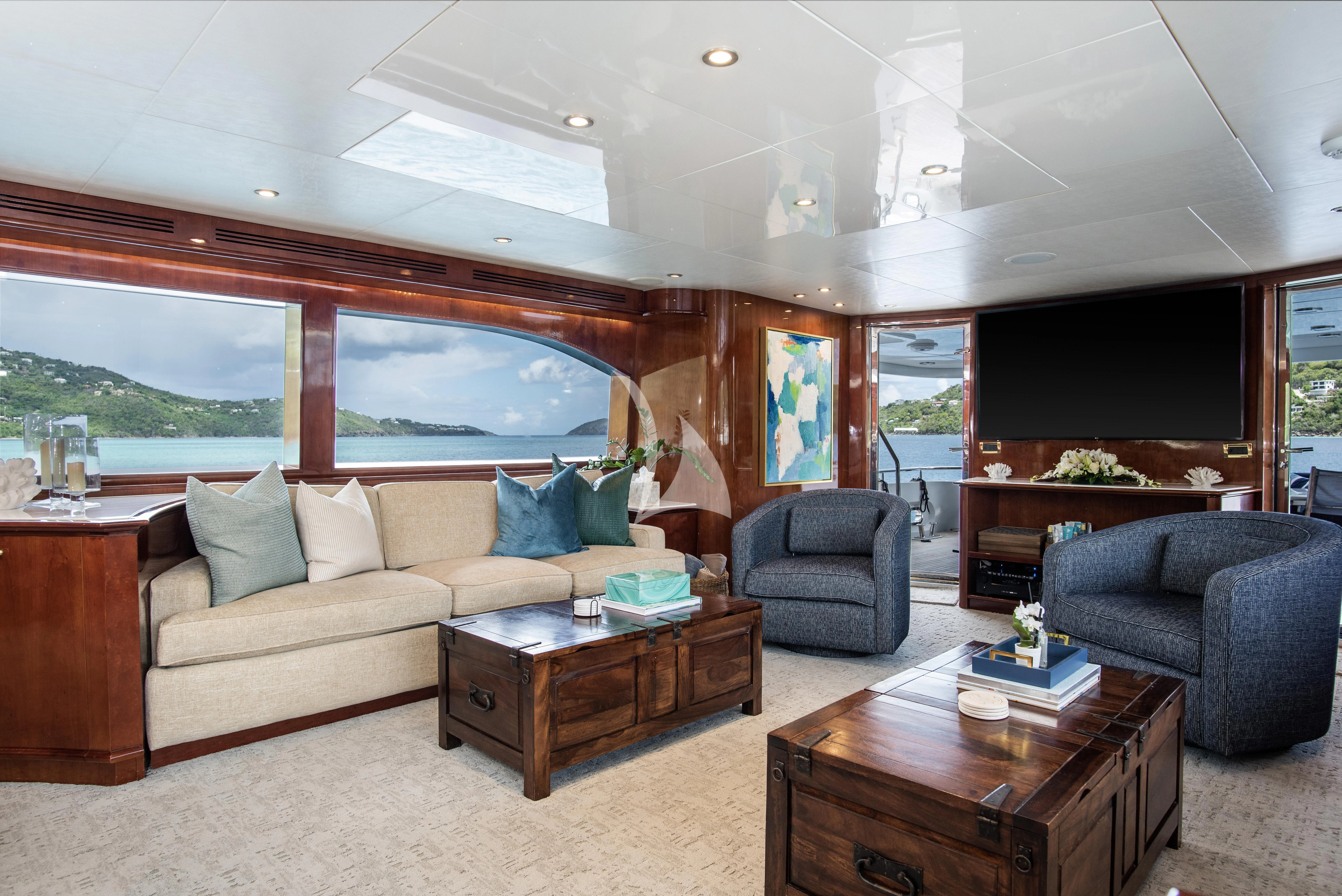 a living room with a couch and a coffee table aboard OUTTA TOUCH Yacht for Sale