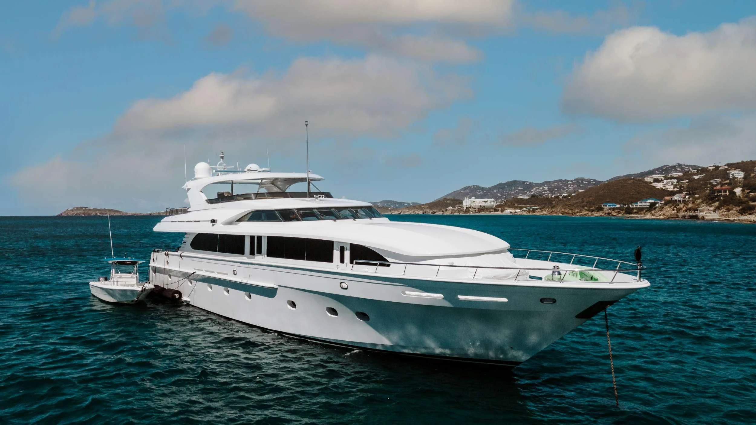 a white yacht in the water aboard OUTTA TOUCH Yacht for Sale