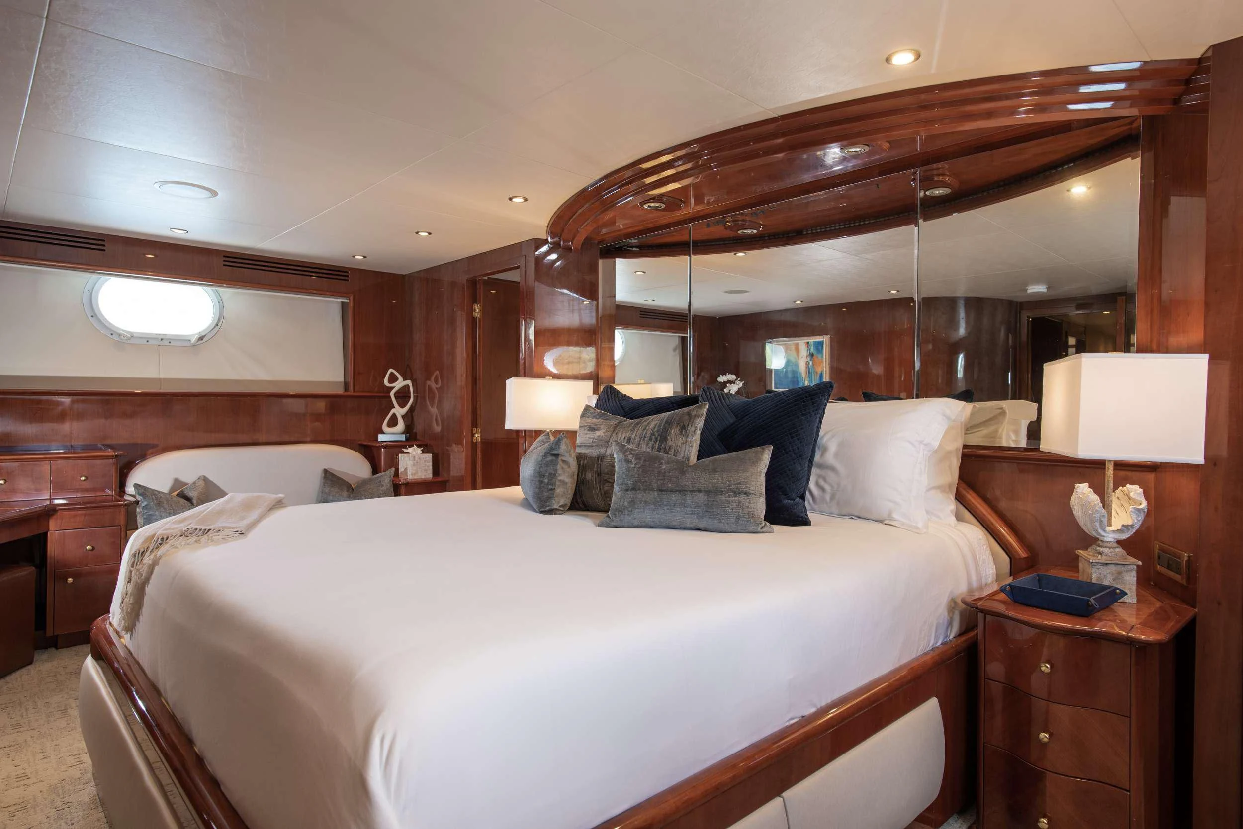 a room with a bed and a mirror aboard OUTTA TOUCH Yacht for Sale