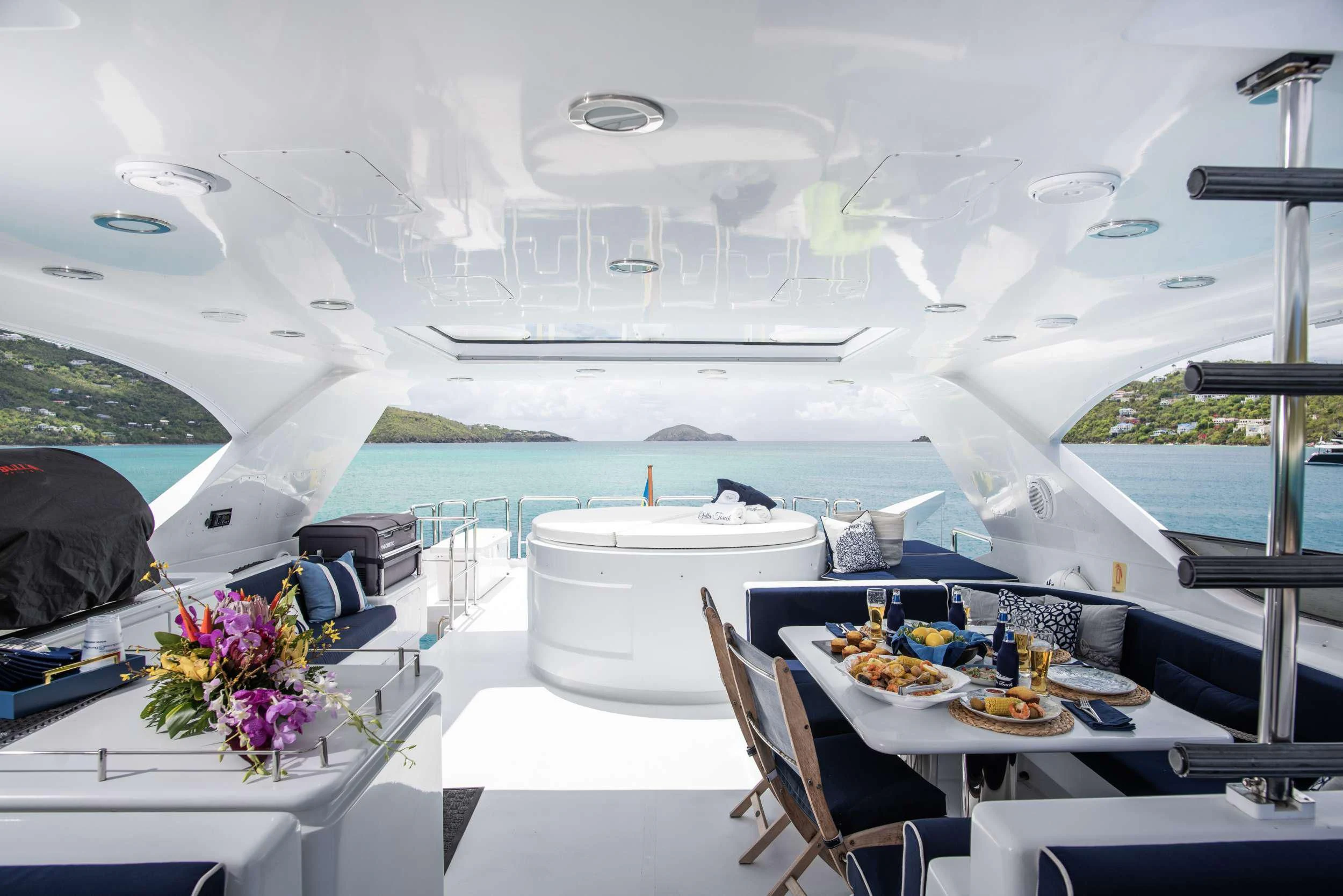 a room with a table and chairs aboard OUTTA TOUCH Yacht for Sale