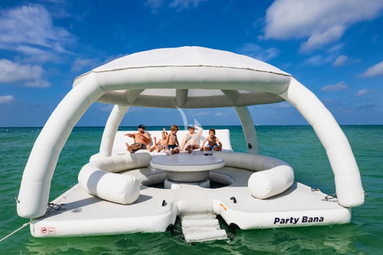 a group of people in a white space ship aboard OUTTA TOUCH Yacht for Sale