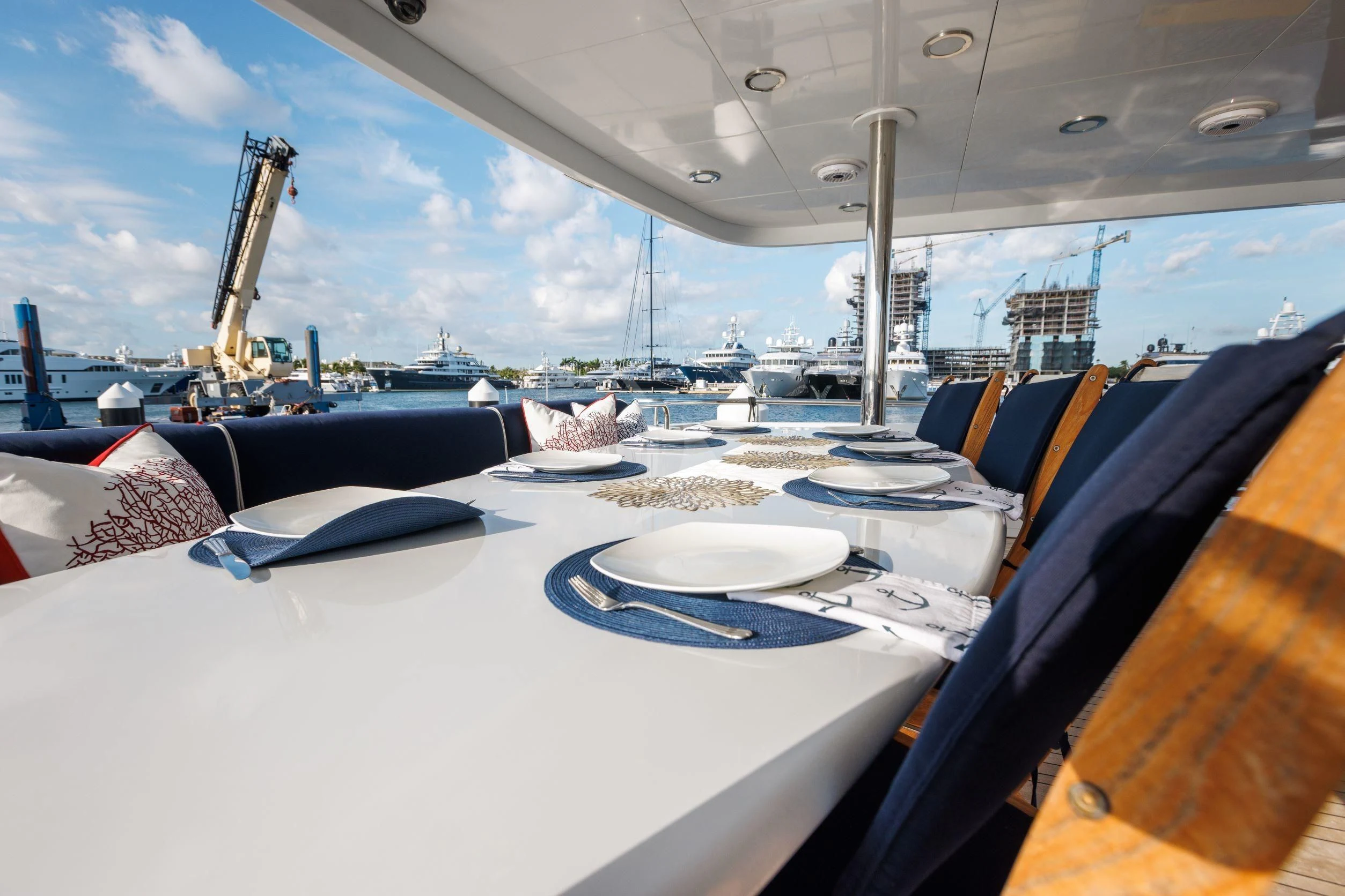 a boat with a table and chairs aboard OUTTA TOUCH Yacht for Sale