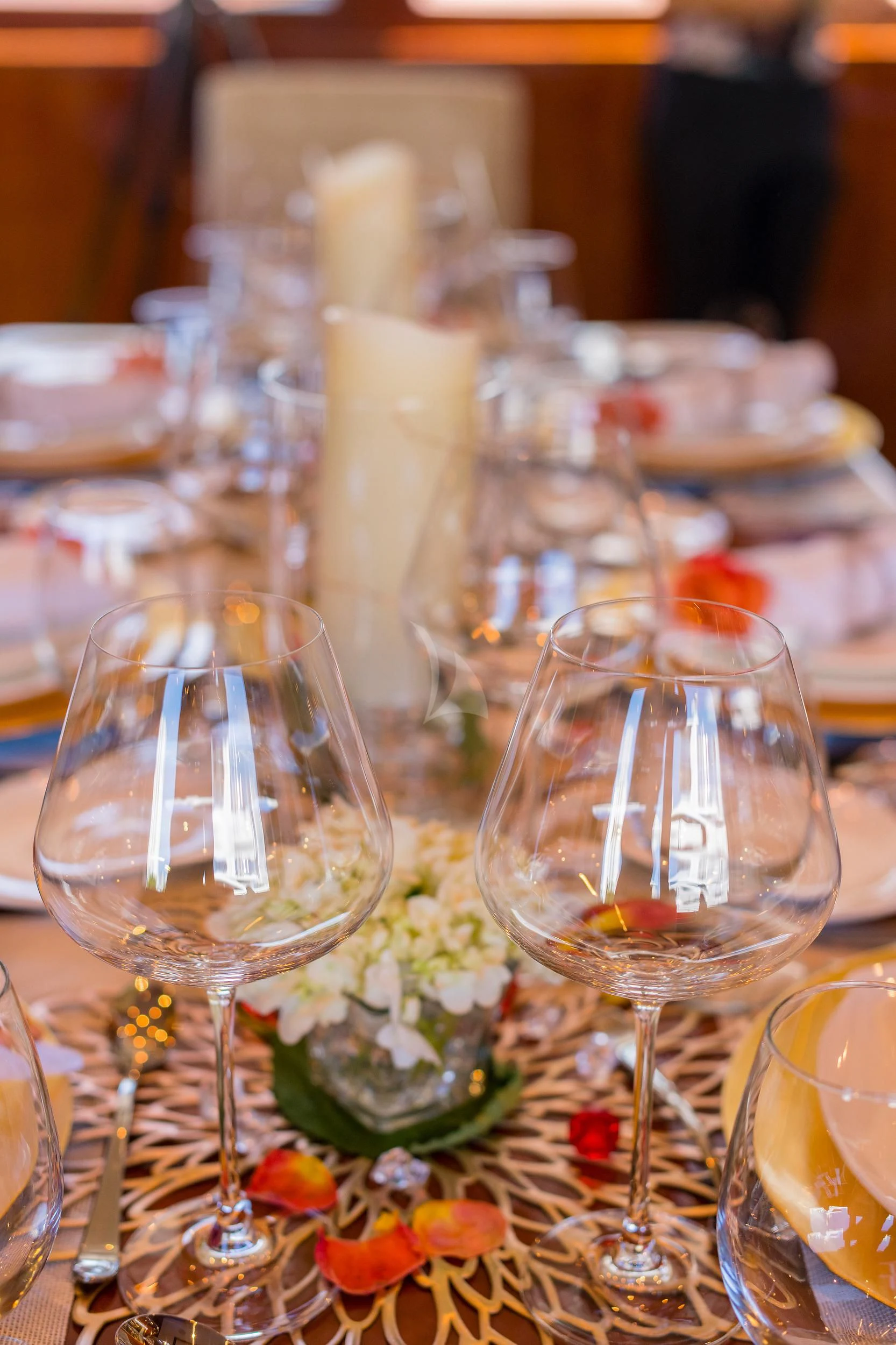 a table with wine glasses and food aboard OUTTA TOUCH Yacht for Sale