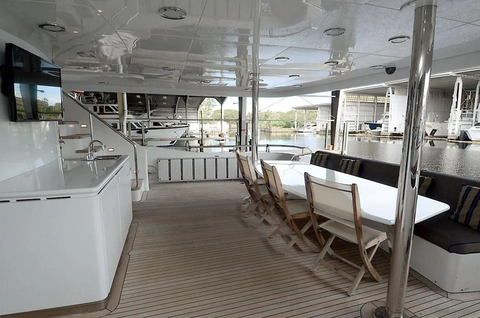a room with tables and chairs aboard OUTTA TOUCH Yacht for Sale