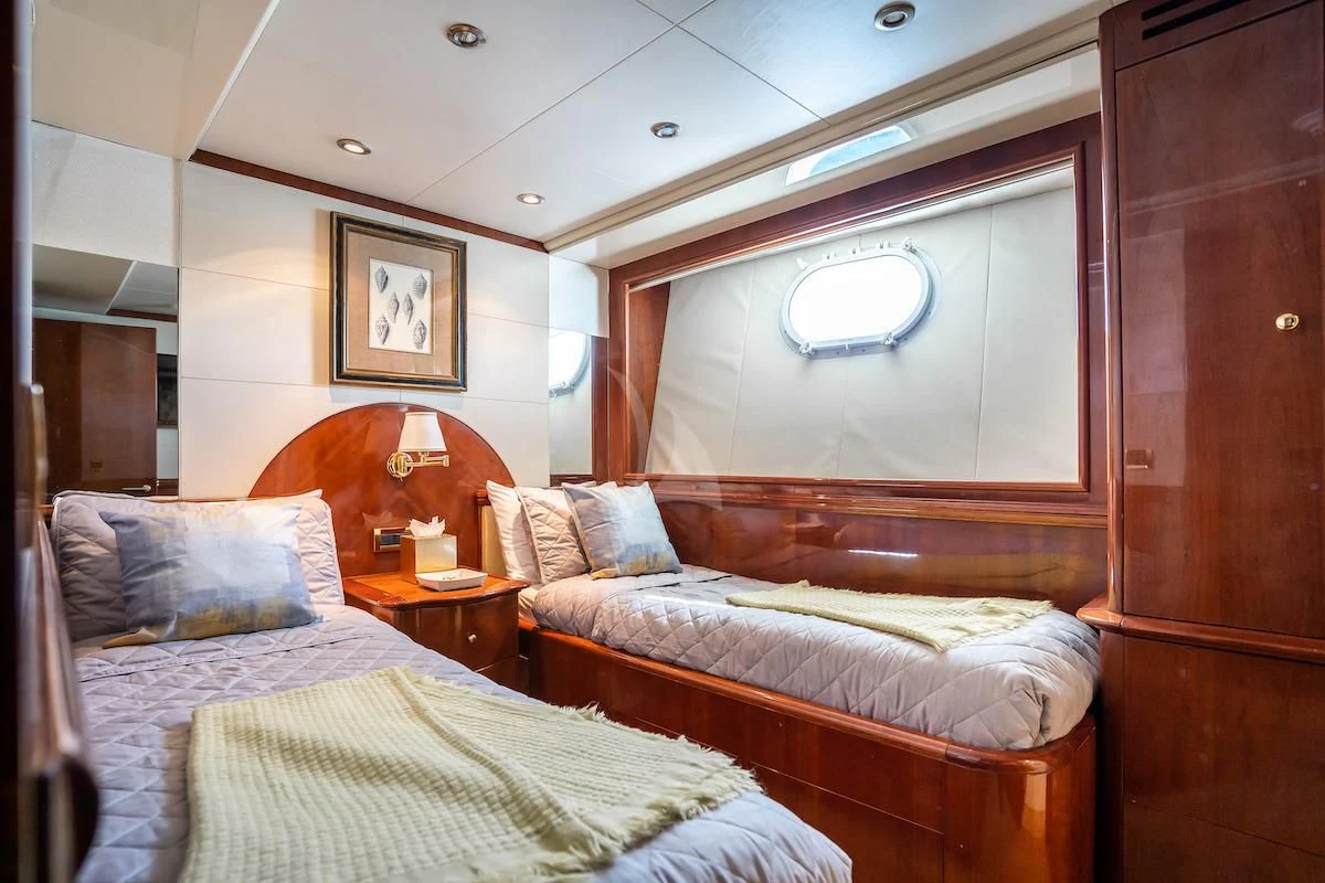 a room with two beds aboard OUTTA TOUCH Yacht for Sale