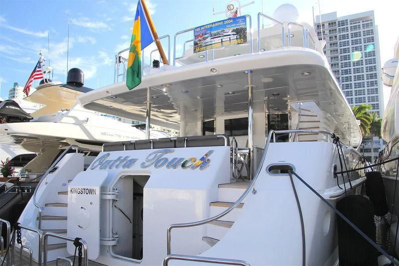 a boat with flags on it aboard OUTTA TOUCH Yacht for Sale