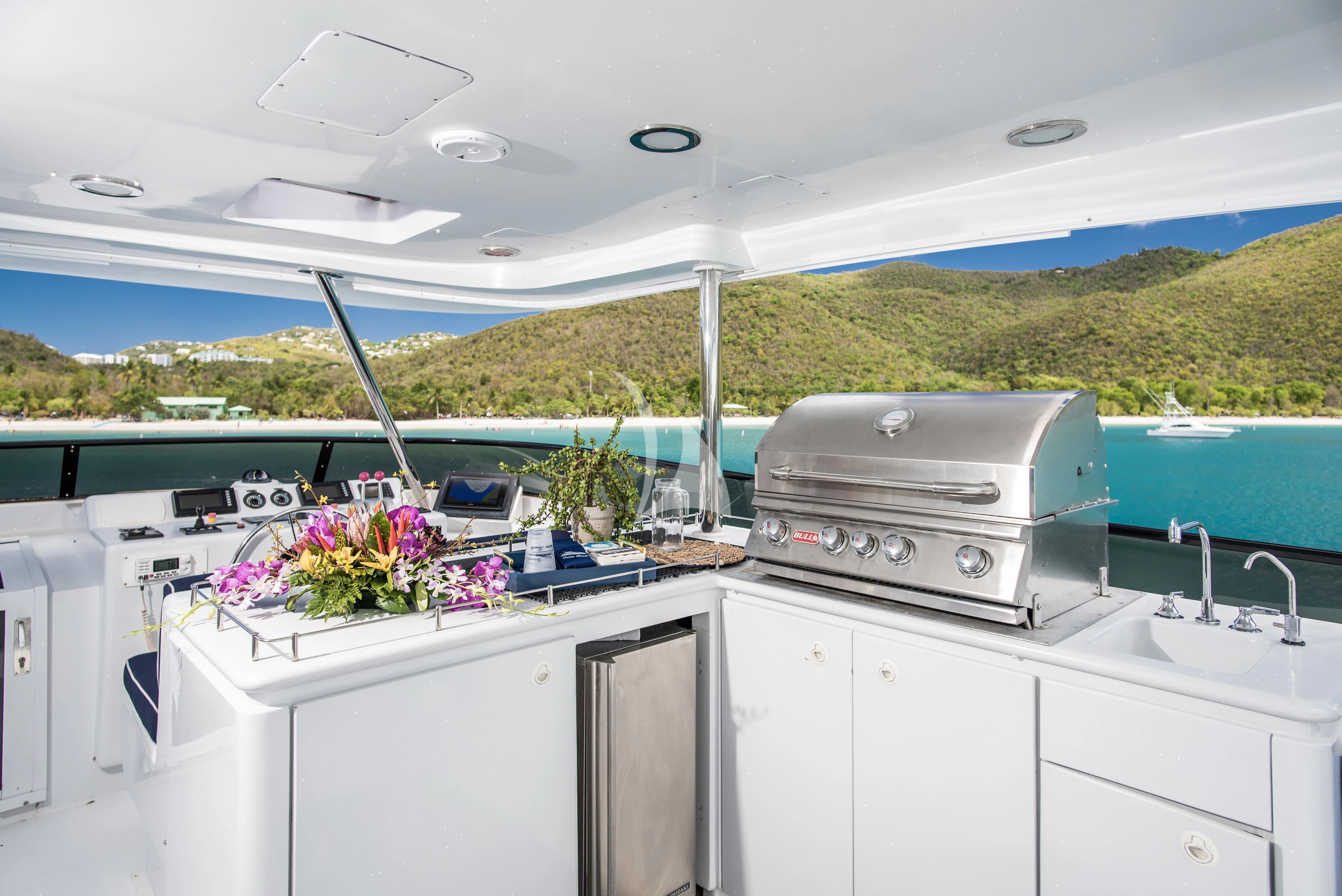 a kitchen with a sink and a microwave aboard OUTTA TOUCH Yacht for Sale