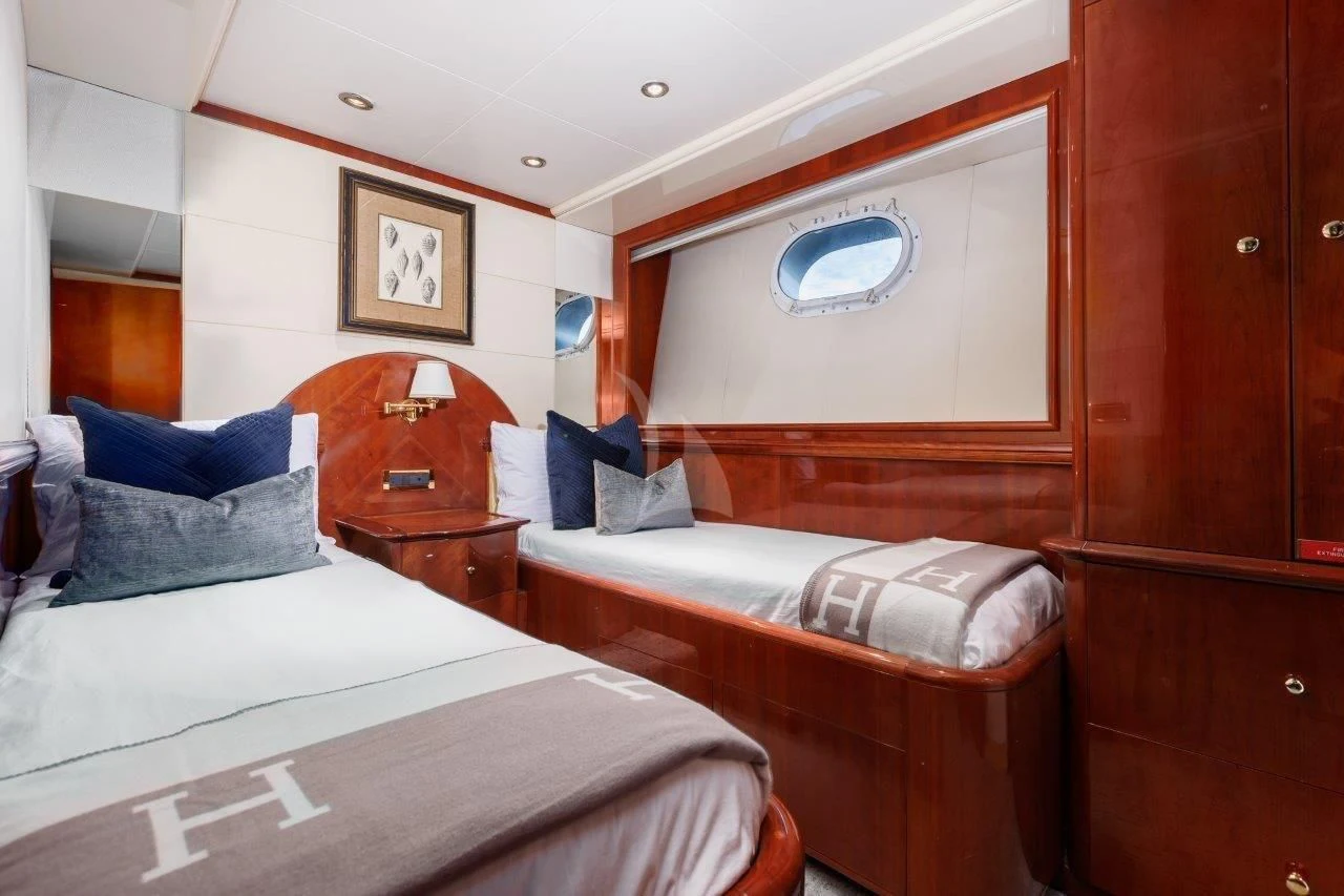 a room with two beds aboard OUTTA TOUCH Yacht for Sale