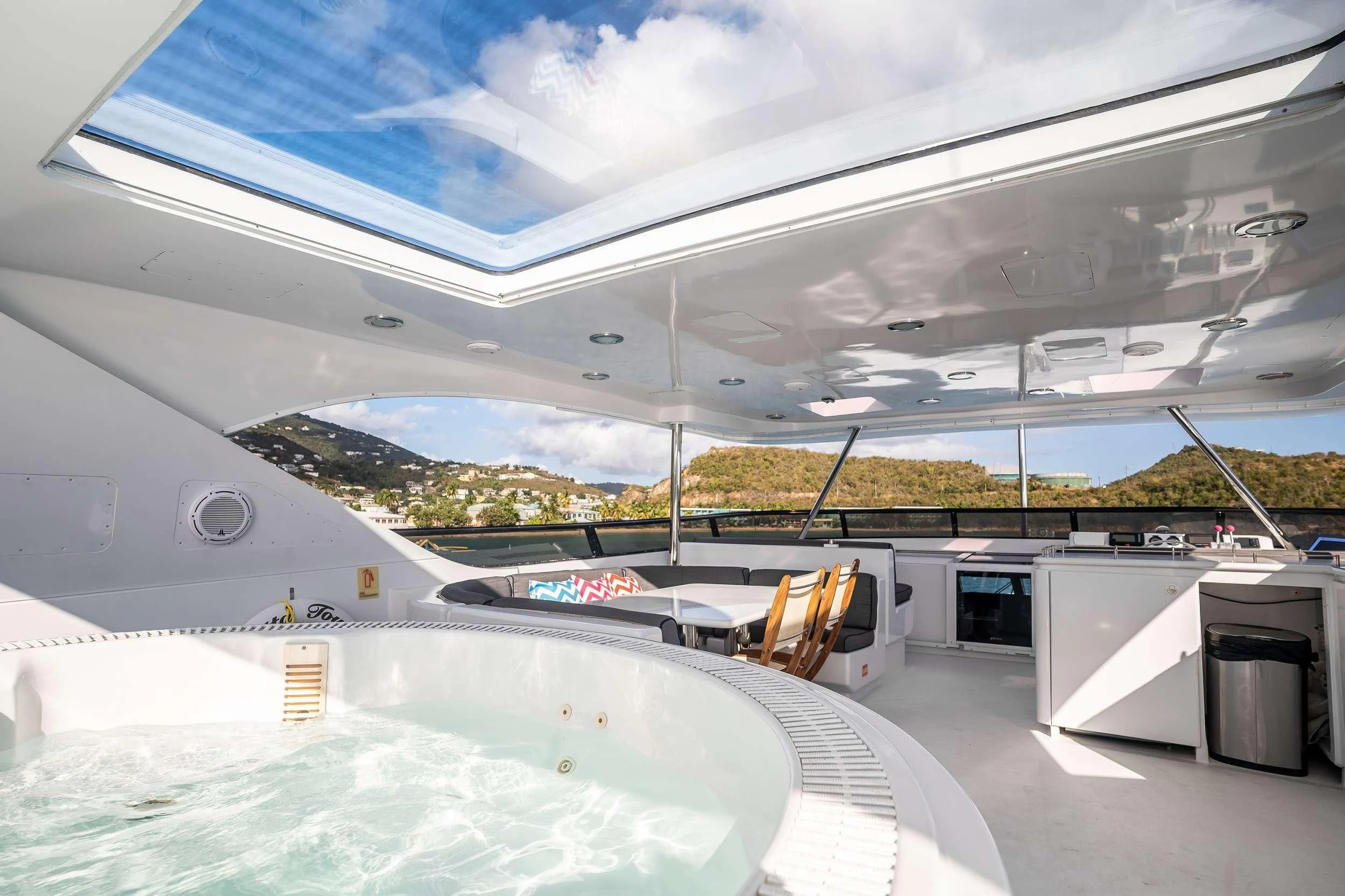 a large room with a large white tent and a large pool aboard OUTTA TOUCH Yacht for Sale