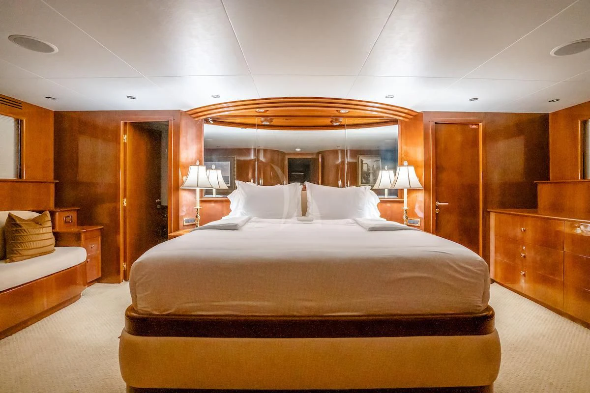 a large bed in a hotel room aboard OUTTA TOUCH Yacht for Sale