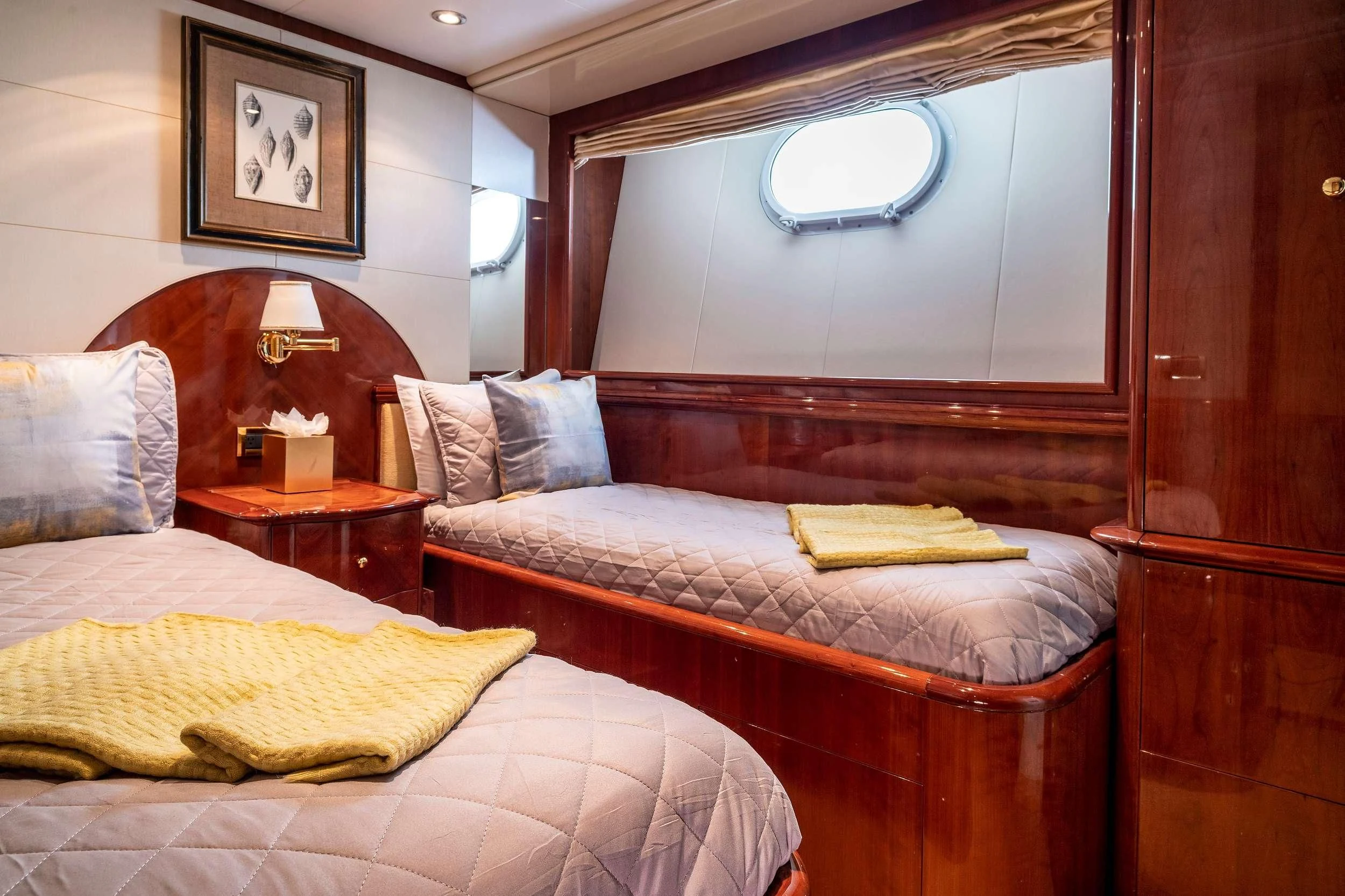 a room with a bed and a mirror aboard OUTTA TOUCH Yacht for Sale