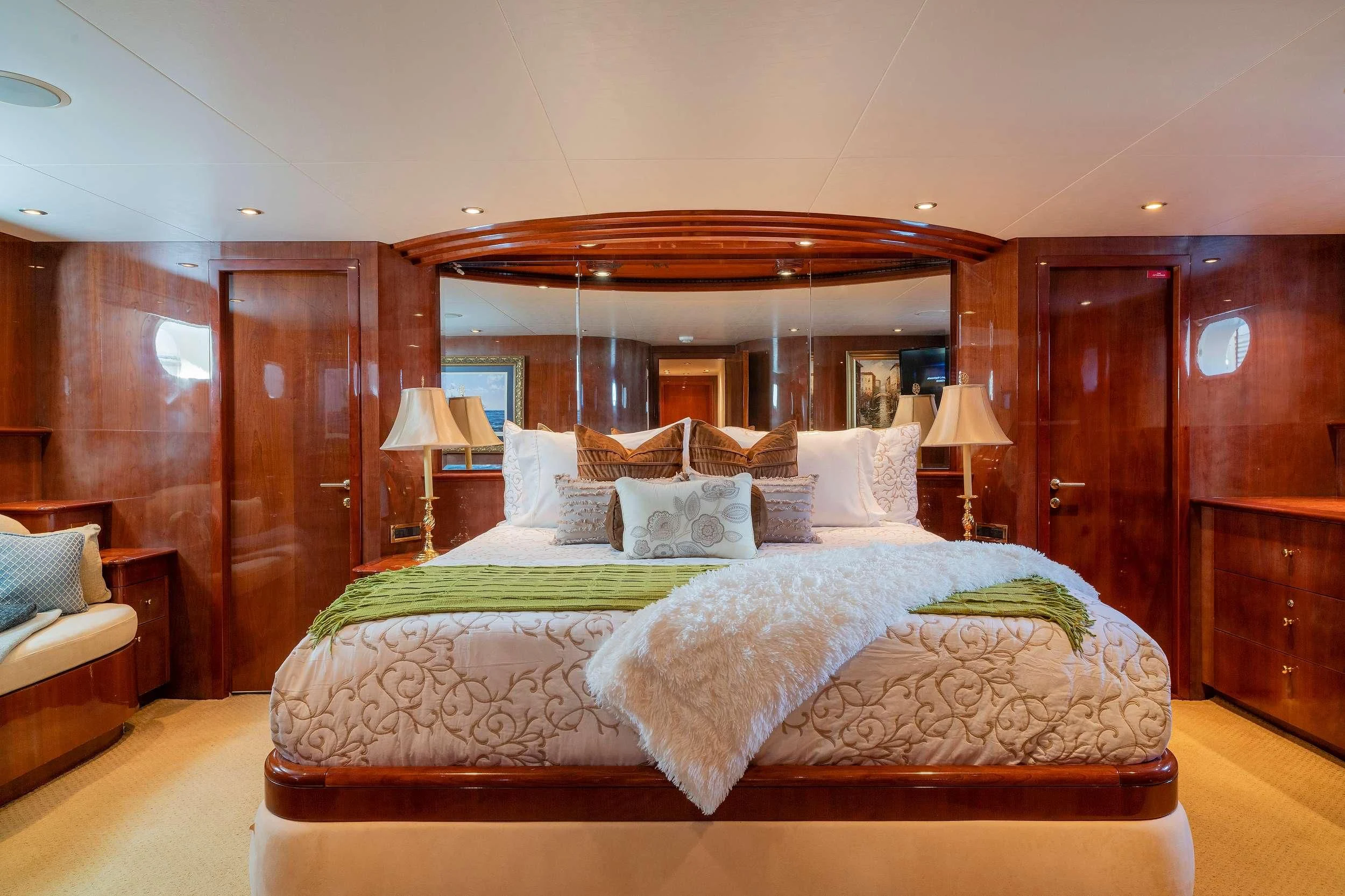 a bed with a mirror above it aboard OUTTA TOUCH Yacht for Sale