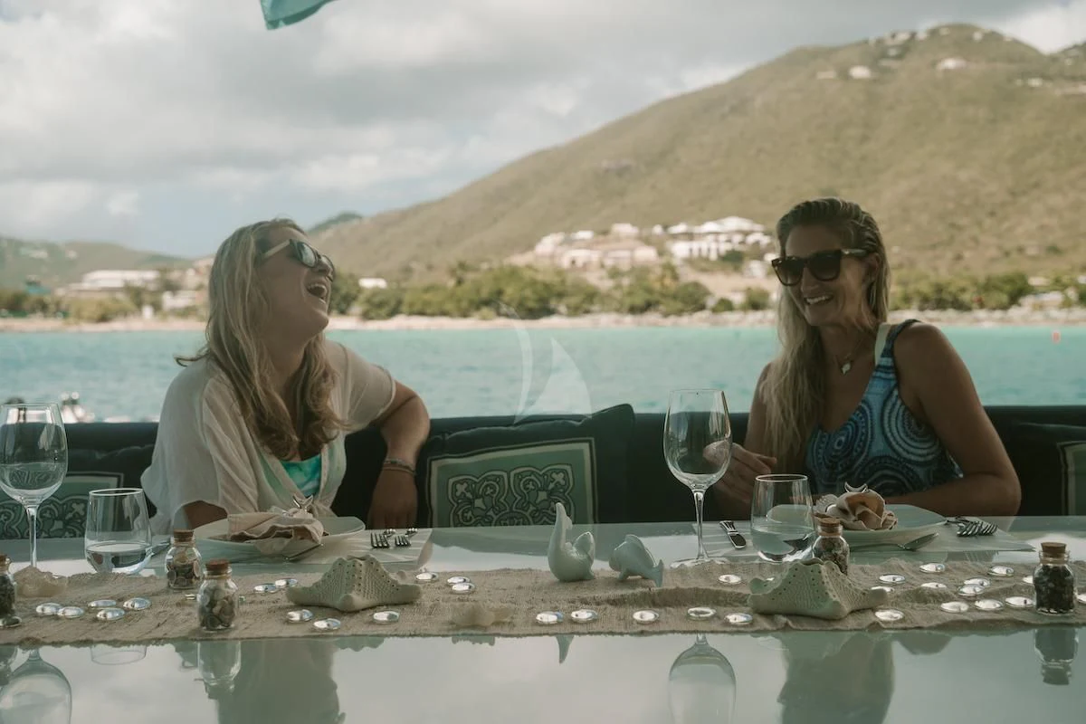 women sitting at a table aboard OUTTA TOUCH Yacht for Sale
