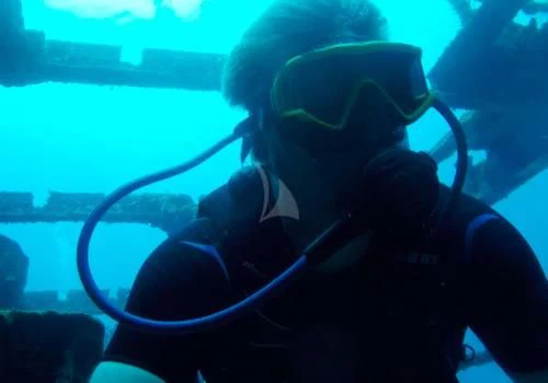 a person wearing a scuba mask aboard OUTTA TOUCH Yacht for Sale